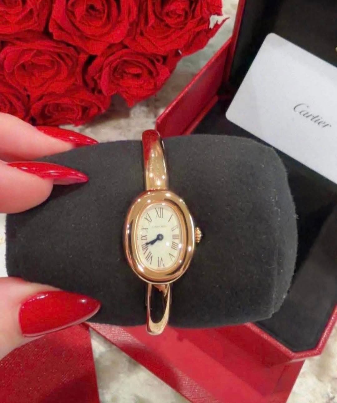 May be an image of wrist watch and text that says 'Cartier Cartier J XII - ط 8 E VI IIA ۱۸ M'