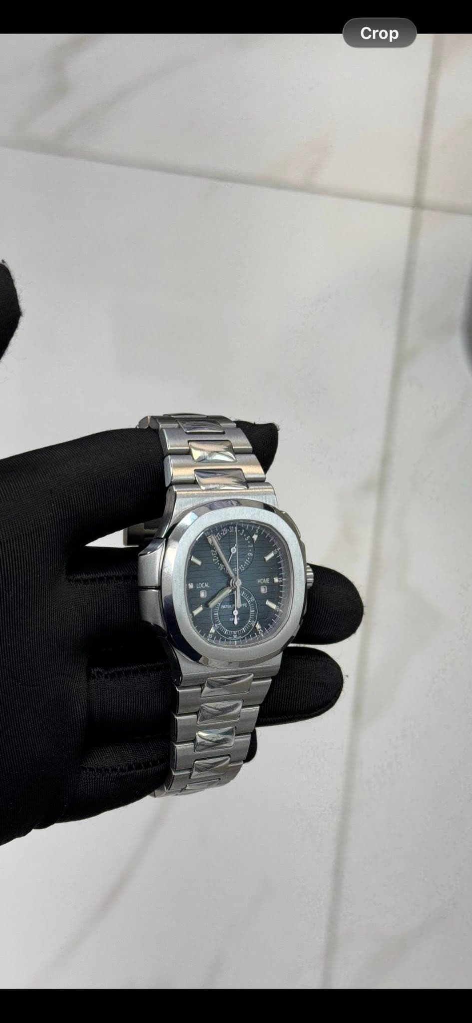 May be an image of wrist watch and text that says 'Crop'
