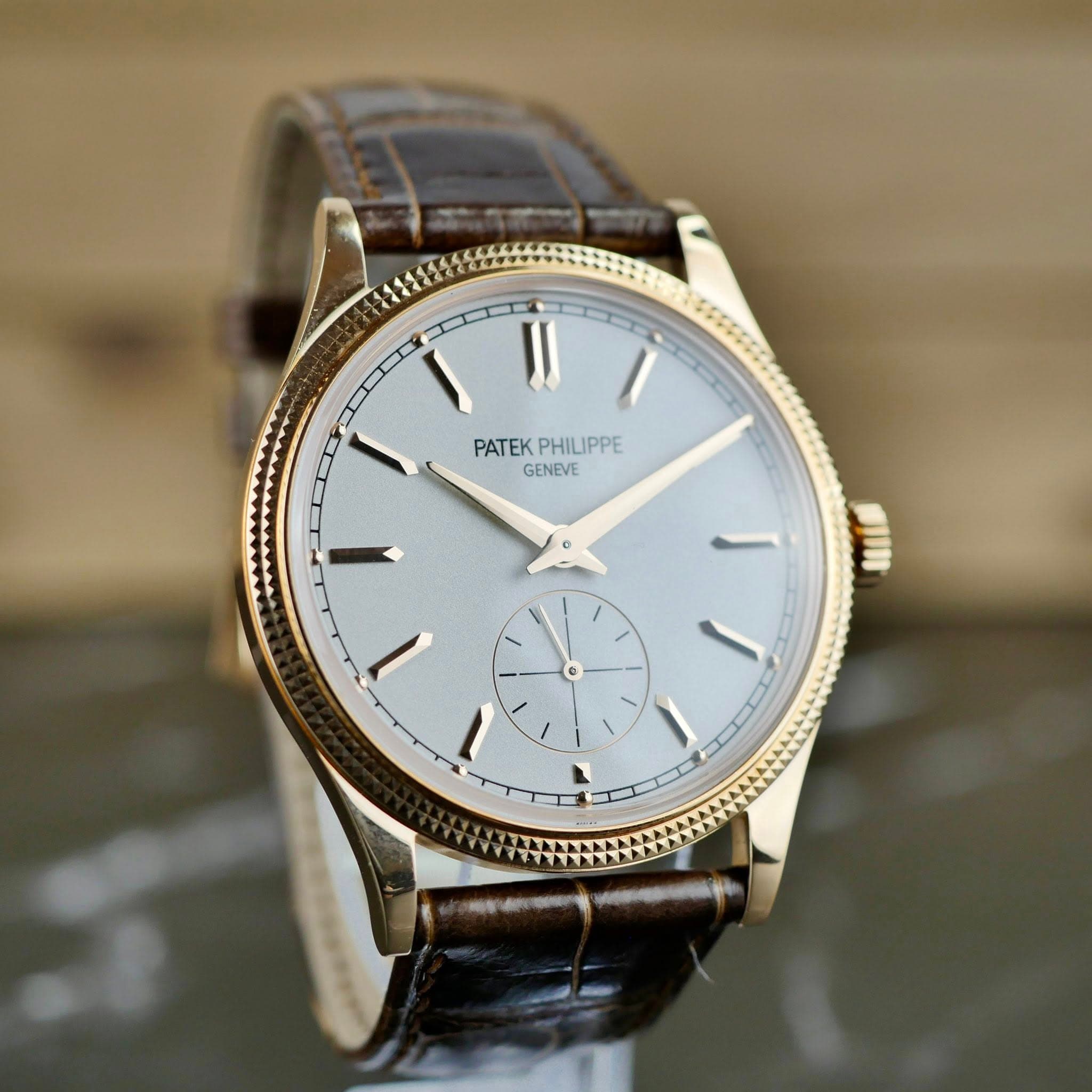 May be an image of wrist watch and text that says 'PATEK PATEKPHILIPPE PHILIPPE PHILIPPE GENEVE I'