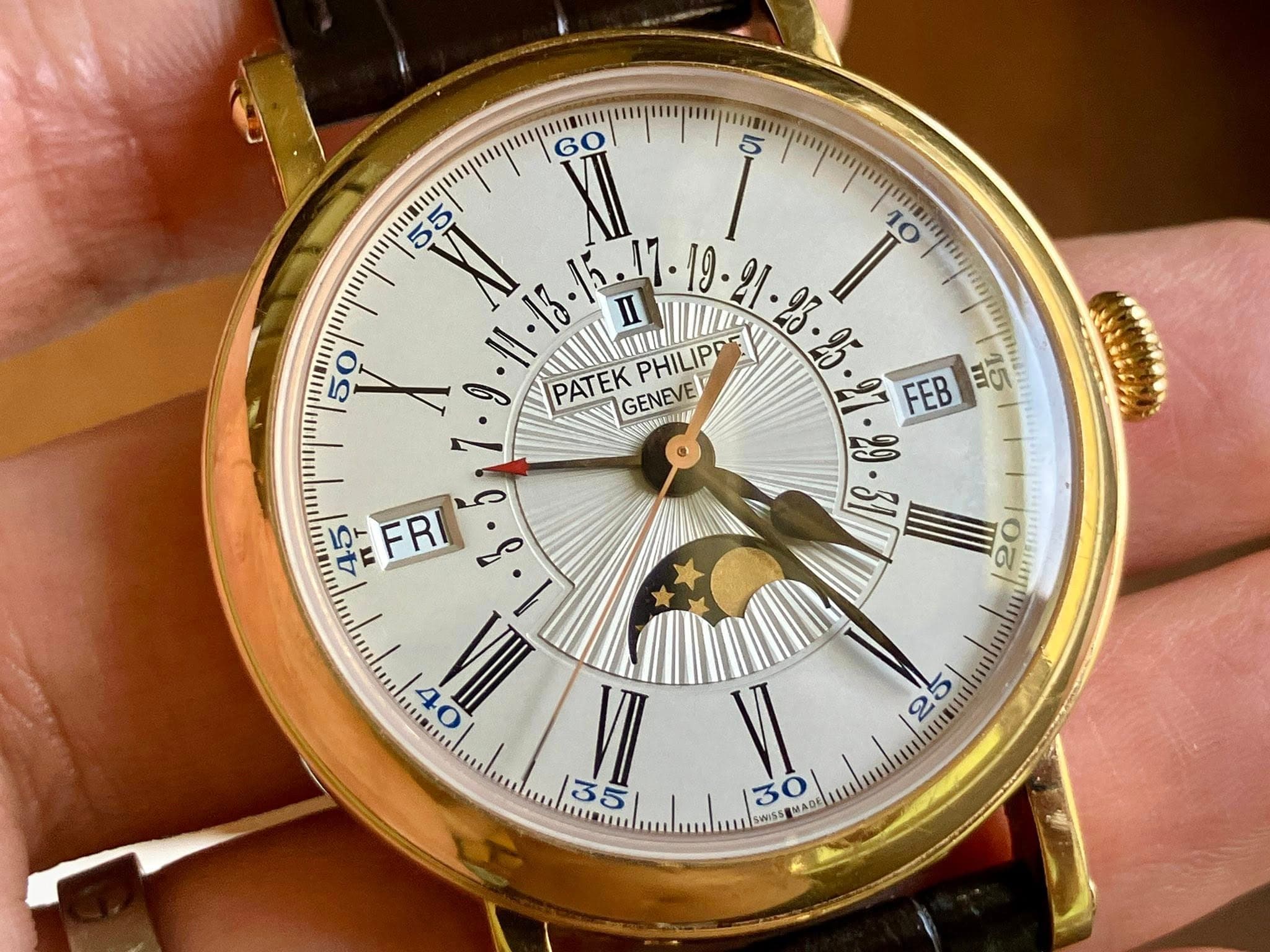May be an image of wrist watch and text