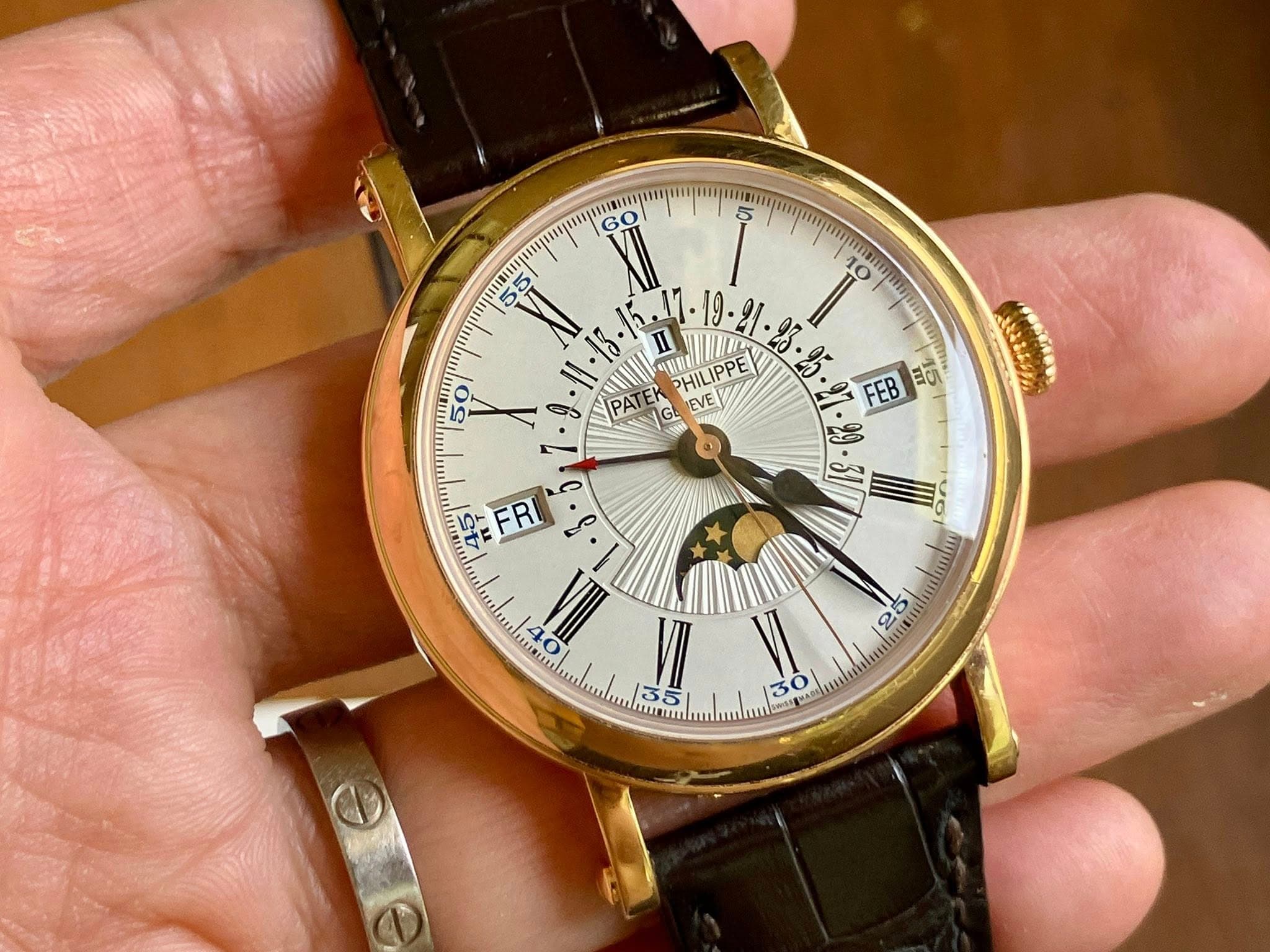 May be an image of wrist watch and text