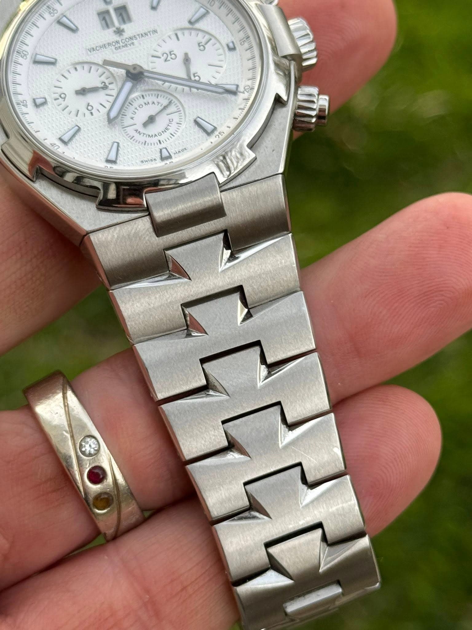 May be an image of wrist watch and text