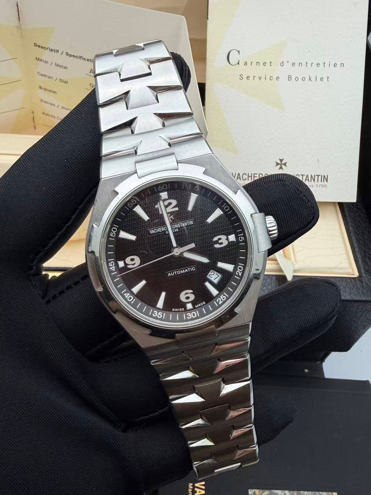 May be an image of wrist watch and text