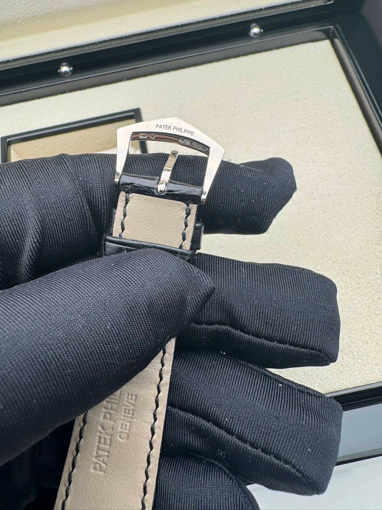 May be an image of saddle-stitched leather, wrist watch and leather