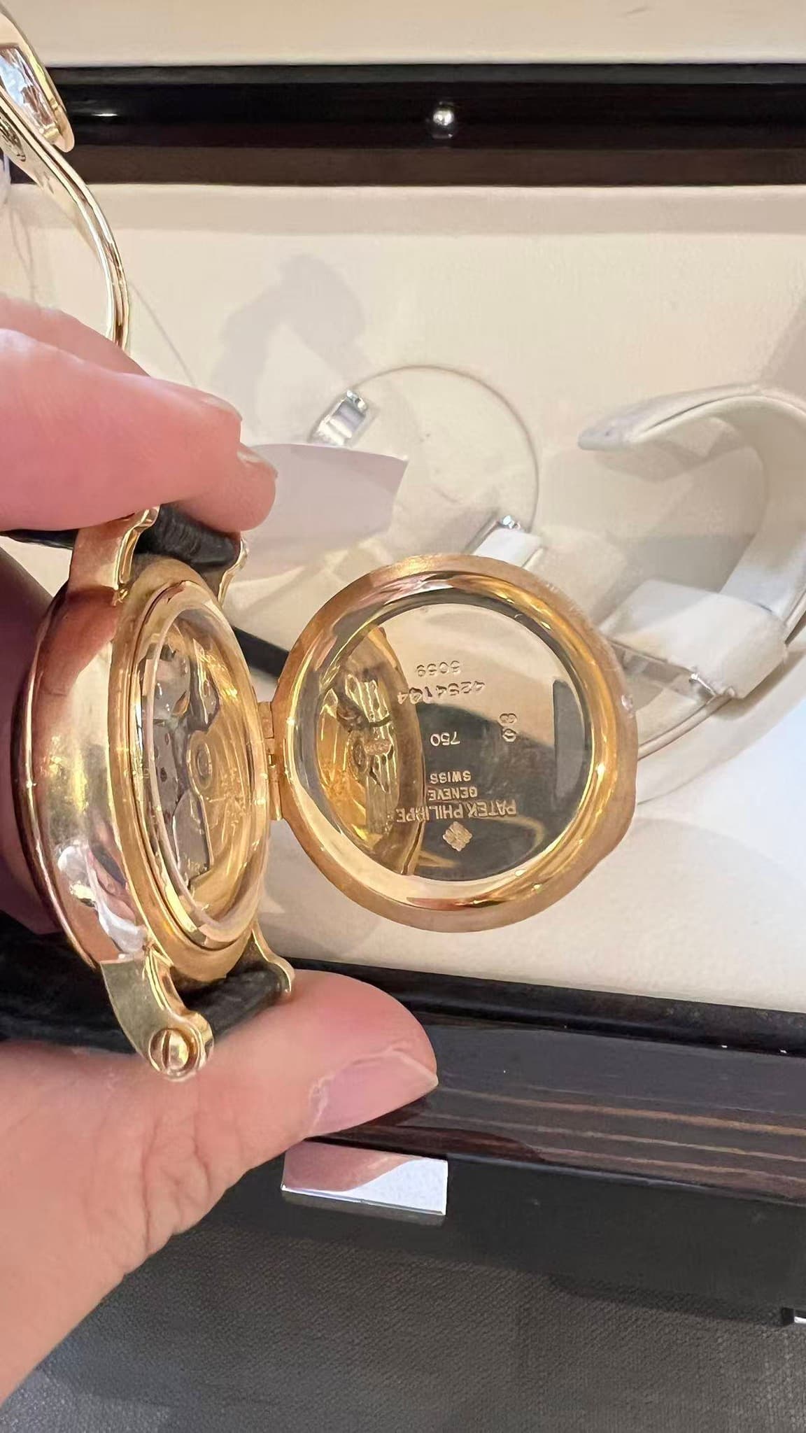 May be an image of wrist watch and ring