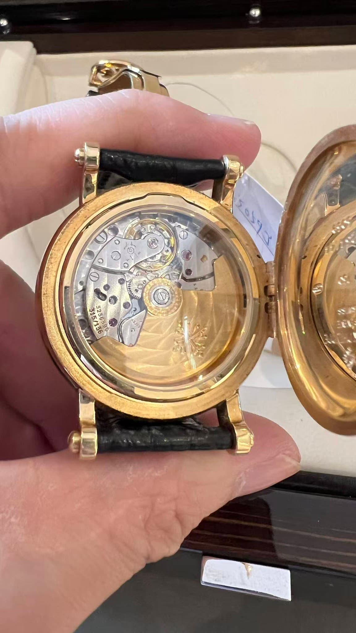 May be an image of wrist watch and text