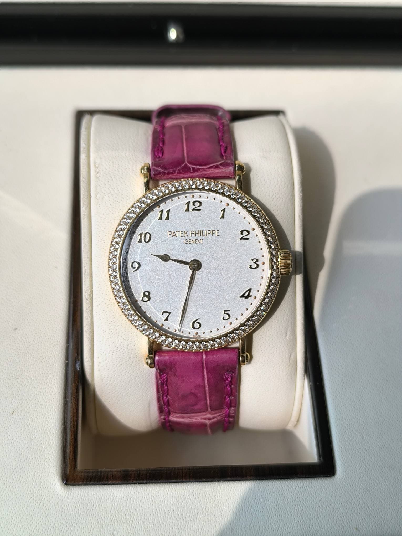 May be an image of wrist watch and text that says '12 10 11 PATEKPHILIPPE PATEK PHILIPPE GENEVE '