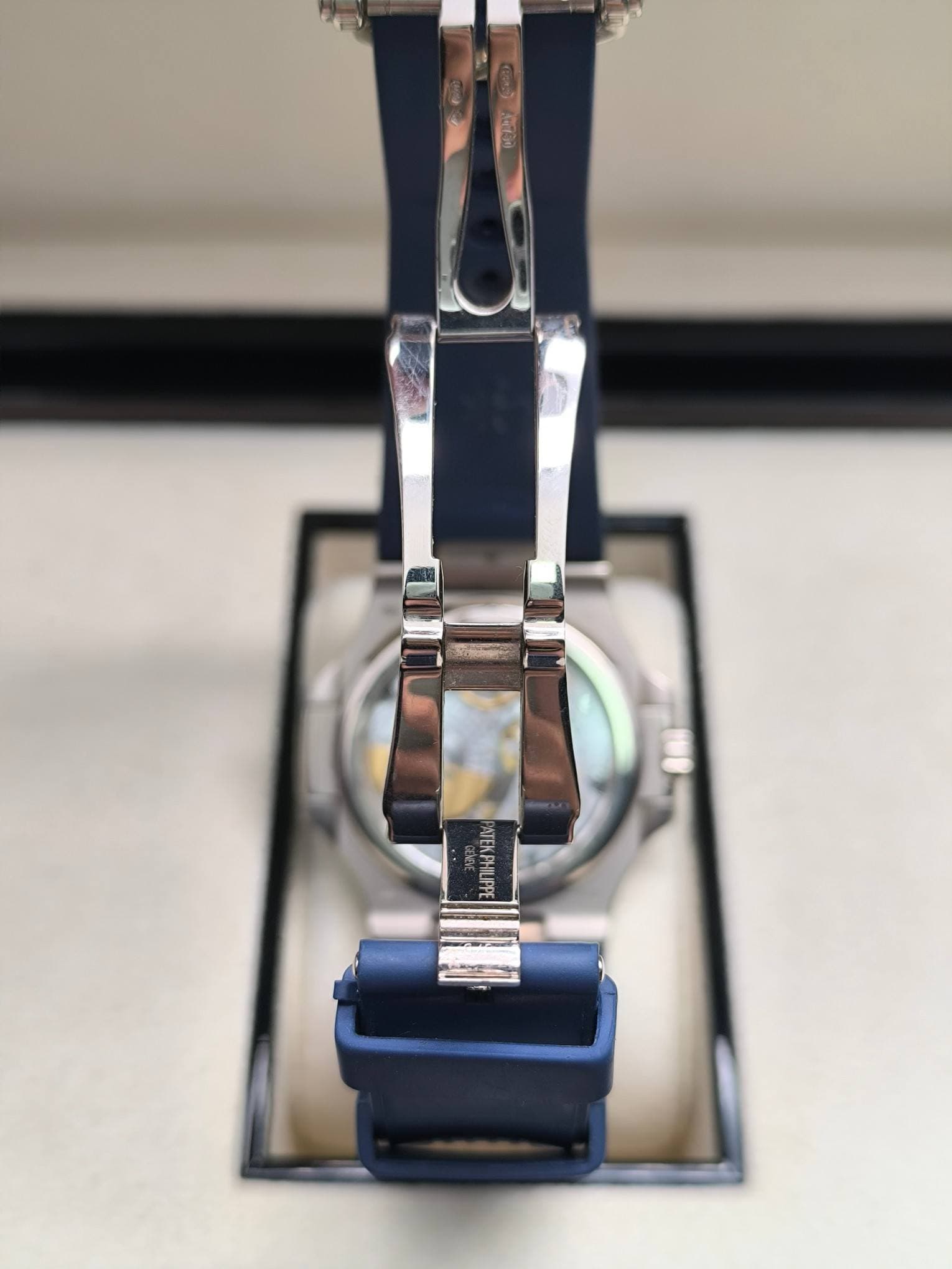 May be an image of wrist watch and text