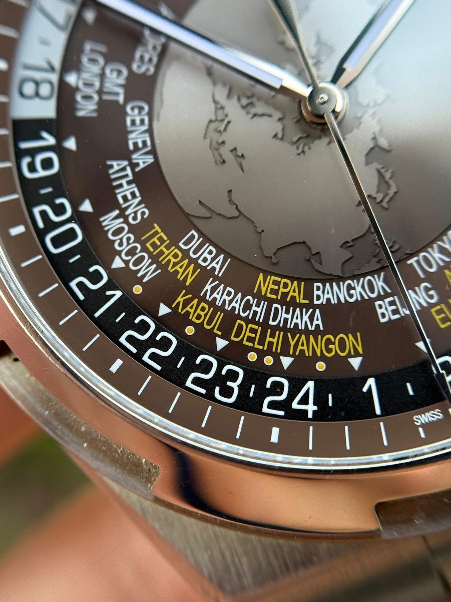 May be an image of wrist watch and text that says '8L NOONOT 号 פוע Sid 19 GENEVA یال 20 MOSCOW TEHRAN DUBAI ATHENS TOK KABUL DELHI YANGON KARACHI DHAKA NEPAL BANGKOK BENING NG…