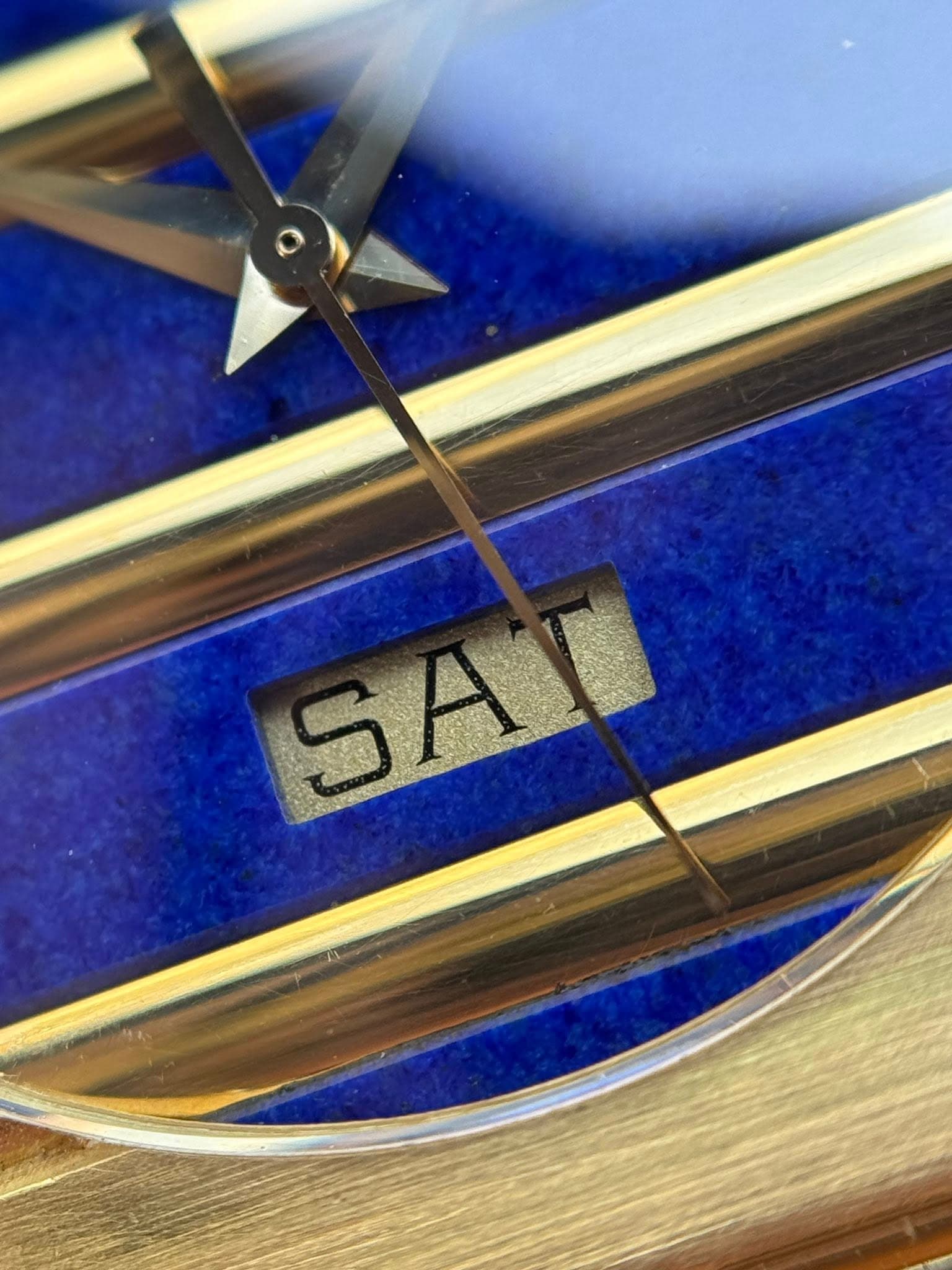 May be an image of wrist watch and text