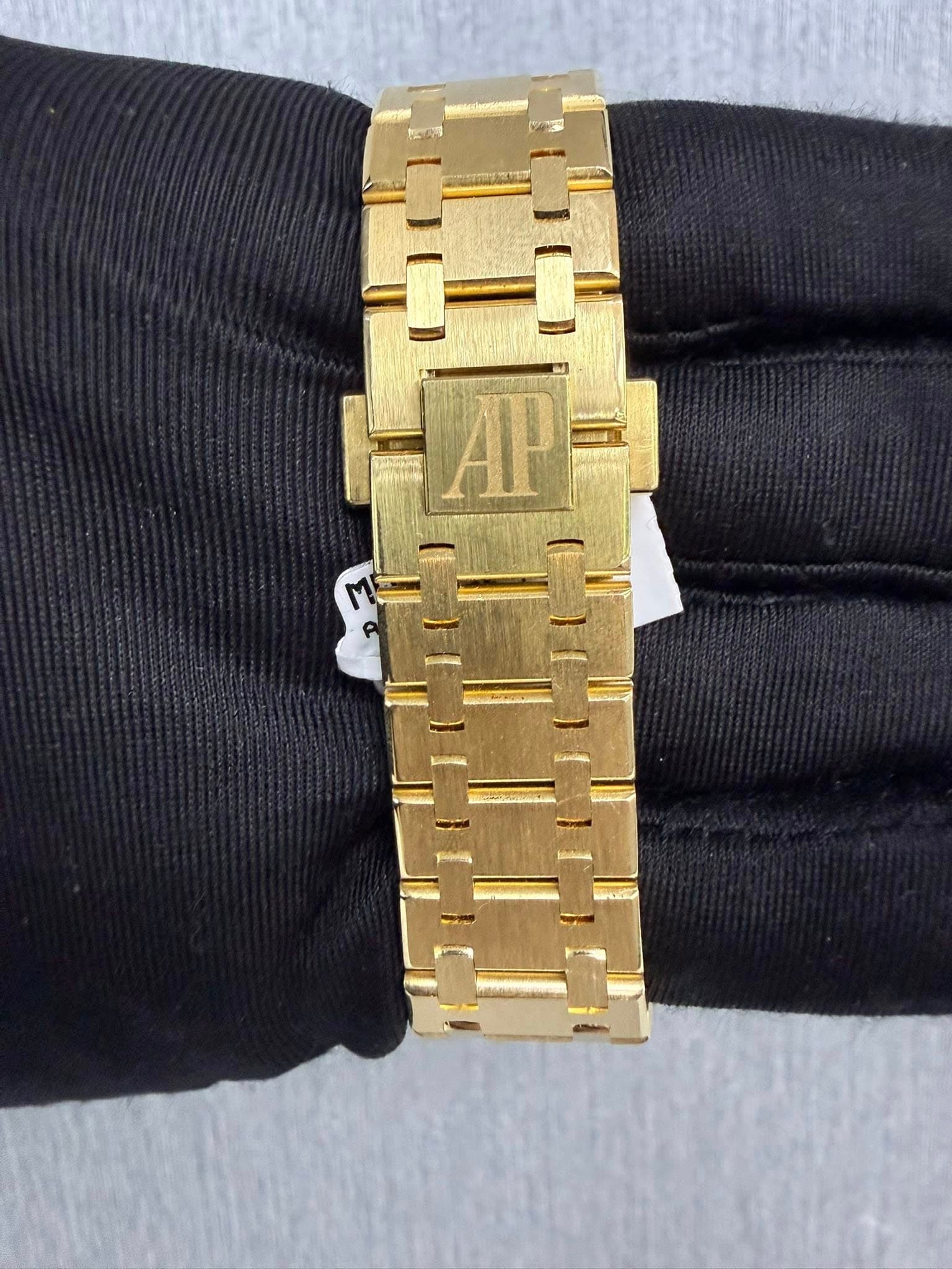 May be an image of wrist watch and text that says 'AP'