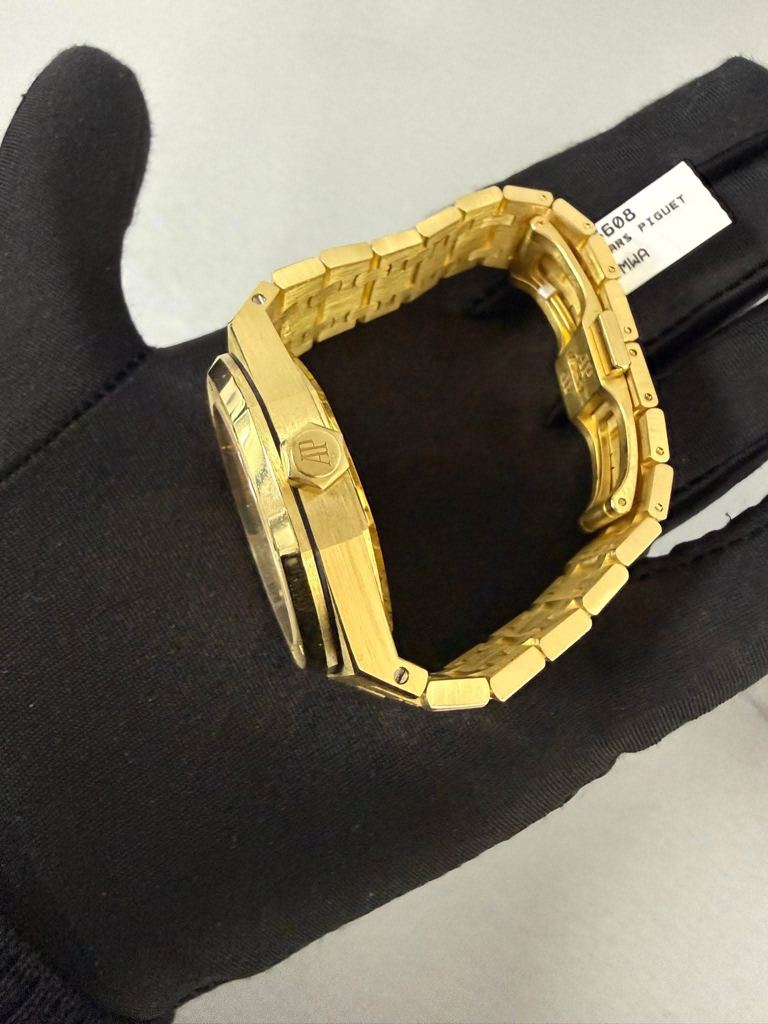 May be an image of jewelry, wrist watch and text that says '608 IGUET ARS MWA R'
