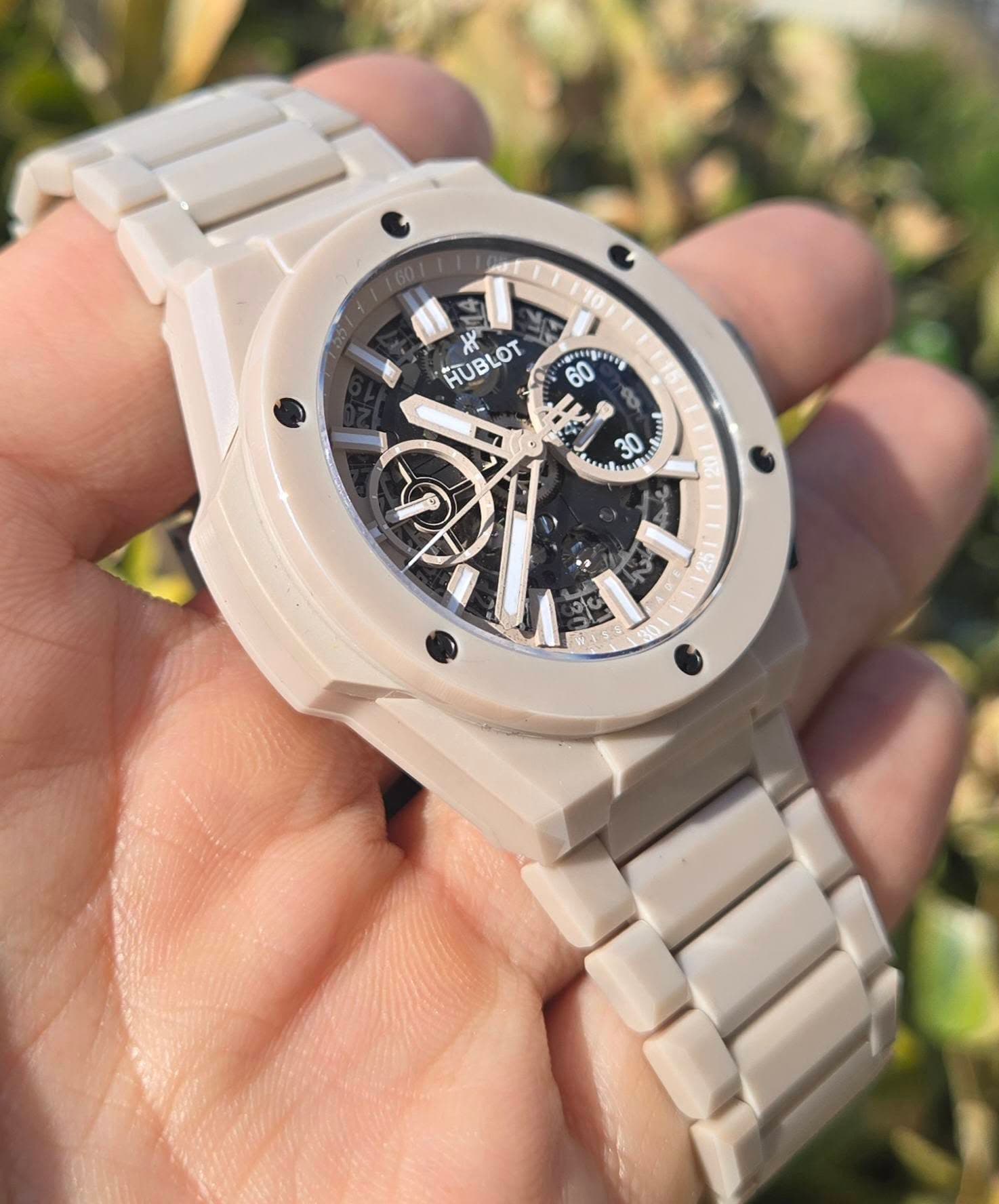 May be an image of wrist watch and text