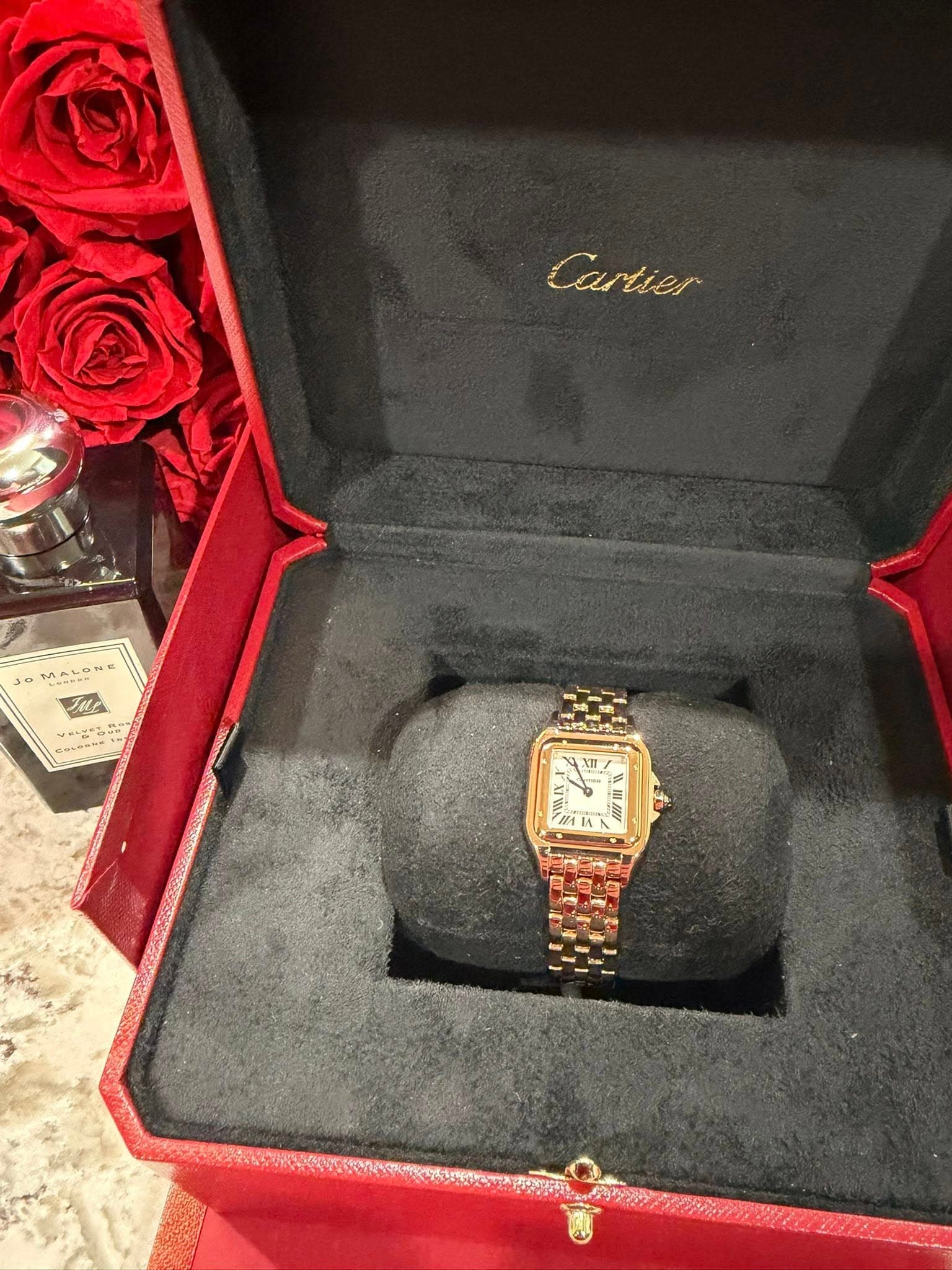 May be an image of wrist watch and text