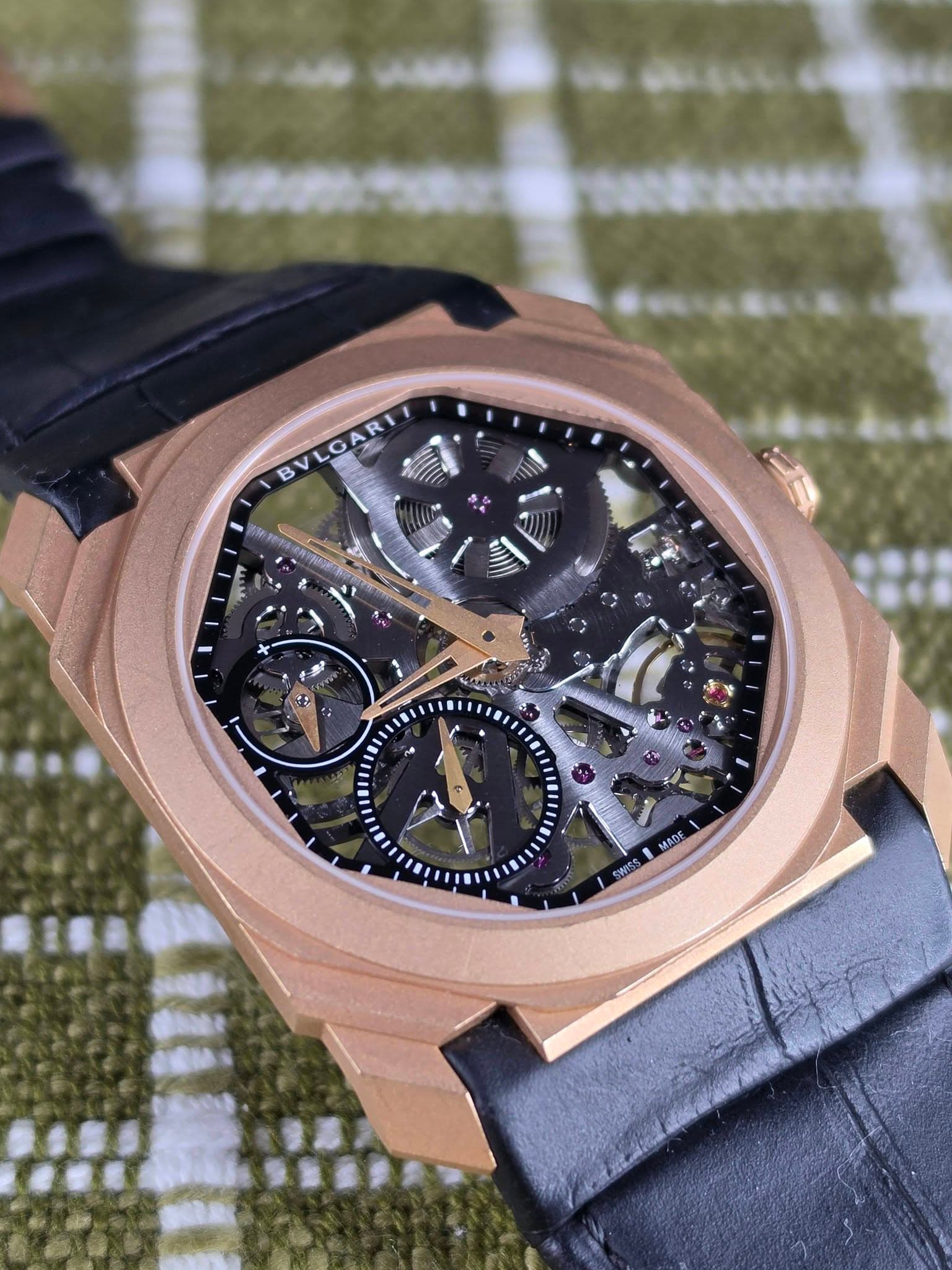 May be an image of wrist watch and text that says 'G B ተር C x K: - na ته F MADE SWASS 1'