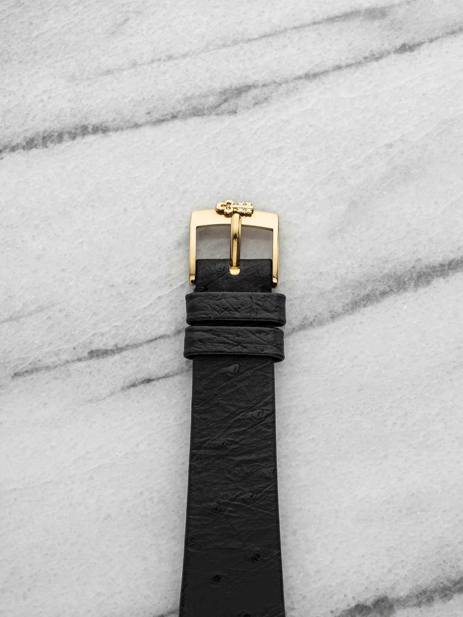 May be an image of wrist watch and leather