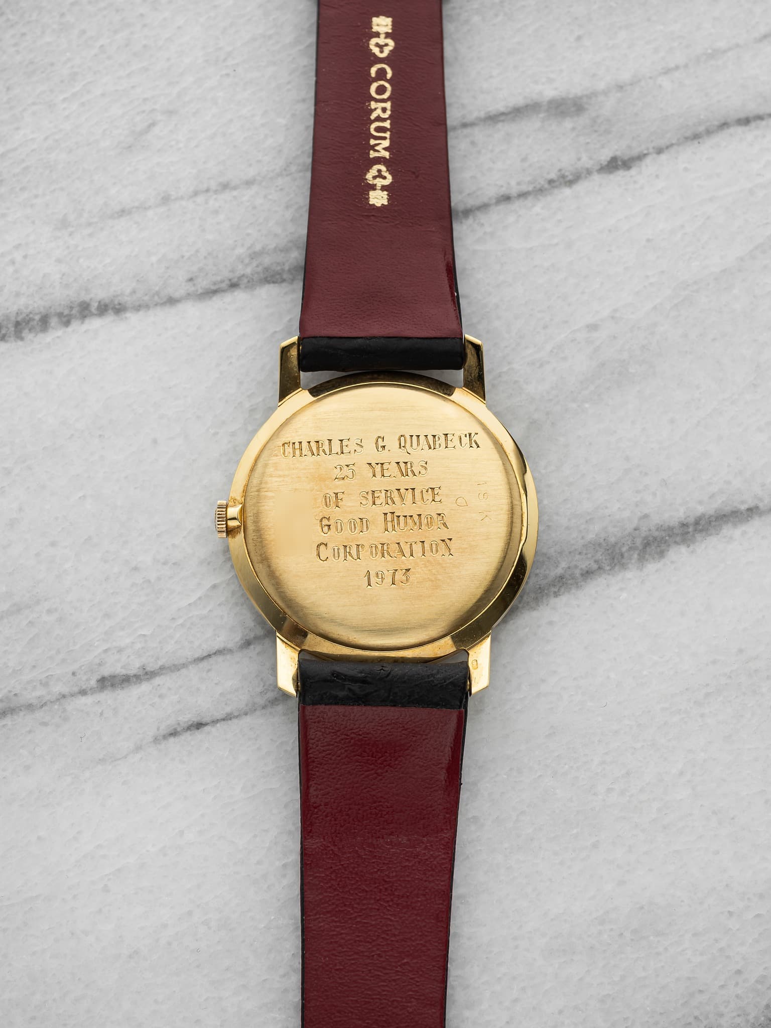 May be an image of wrist watch, leather and text