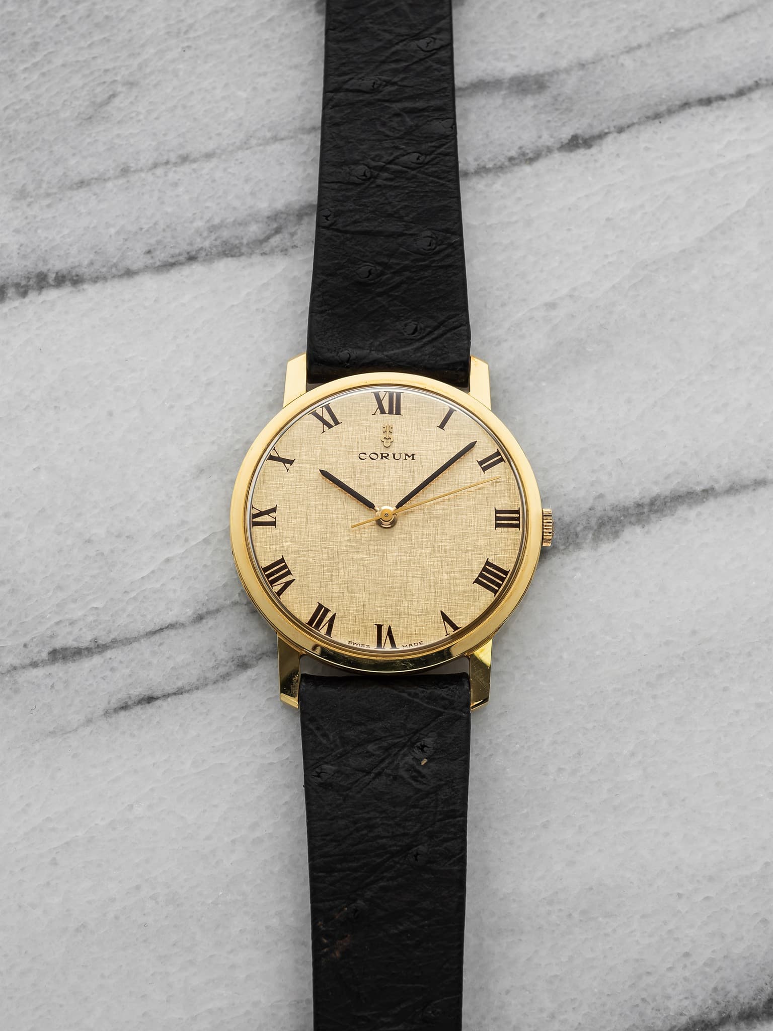 May be an image of wrist watch and leather