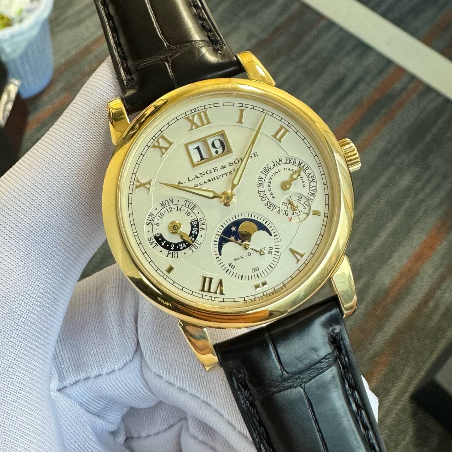 May be an image of wrist watch and text