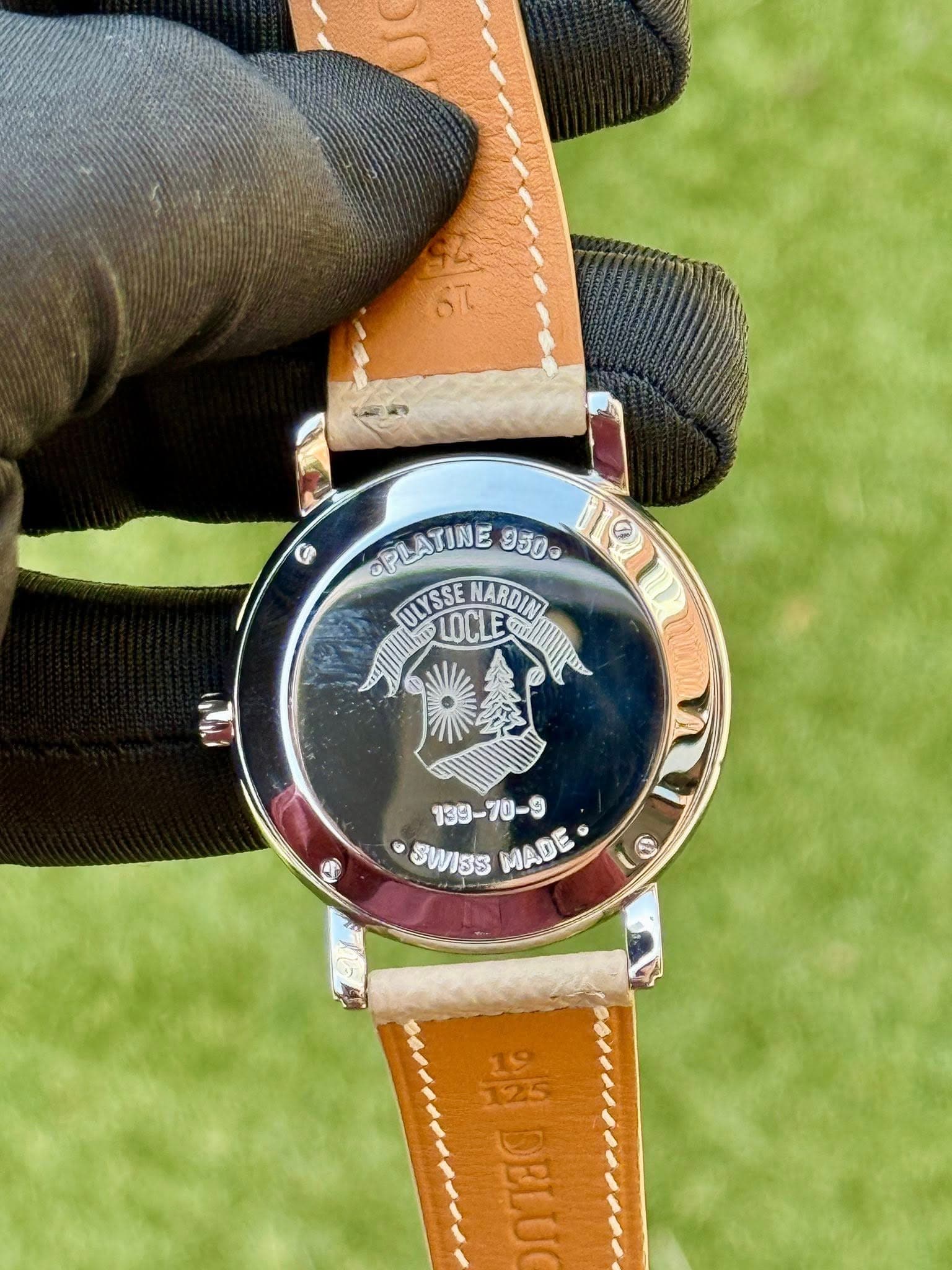 May be an image of leather, digital watch and text that says 'SL CPLATINE 950o 101 ULYSSE LOCLE NARDIN LOCLB an! በክ - SWISS MADE 5 S ಸಿನ DELU'