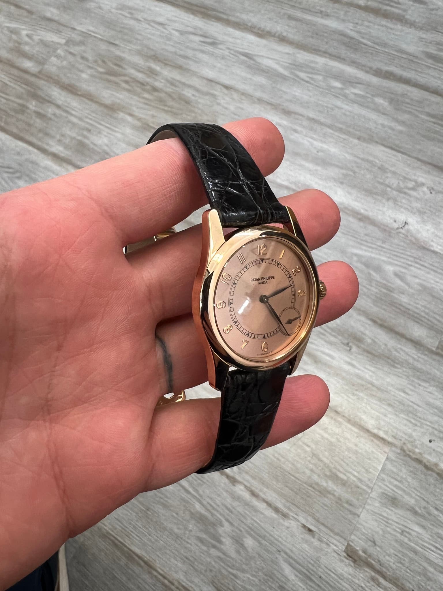 May be an image of wrist watch and text
