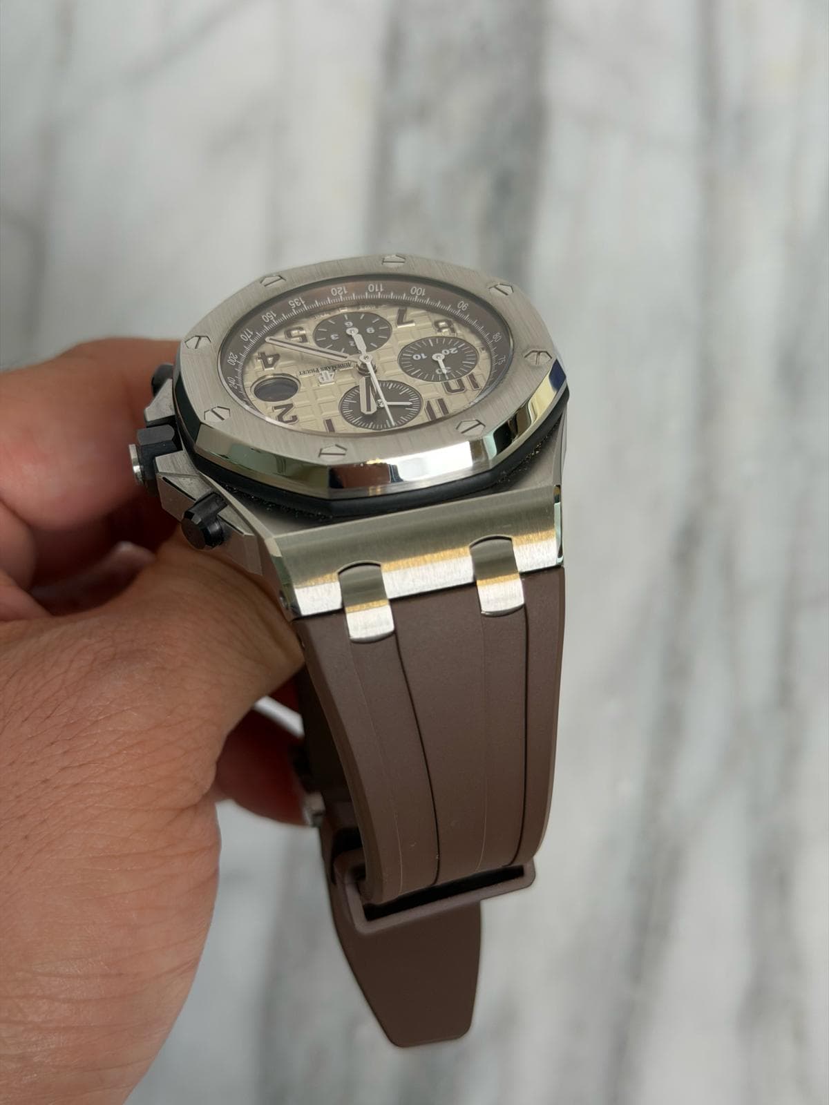 May be an image of wrist watch and text