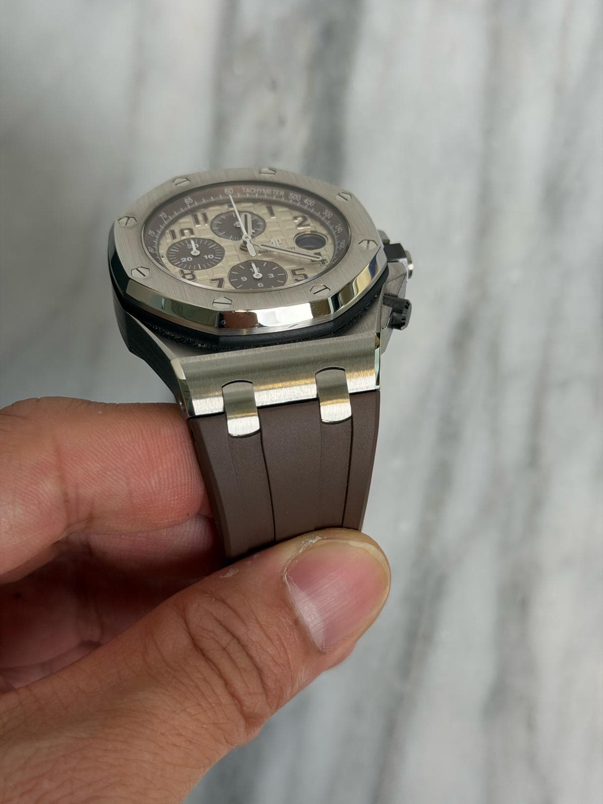May be an image of wrist watch and text