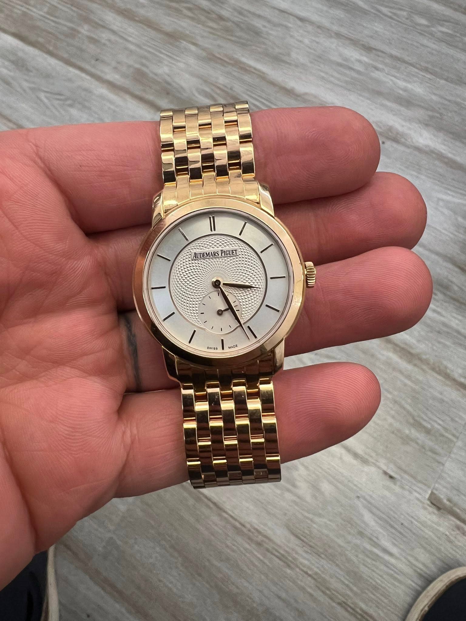 May be an image of wrist watch and text