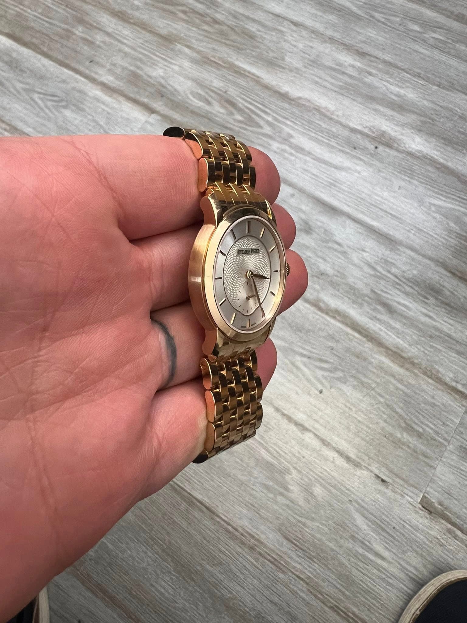 May be an image of wrist watch