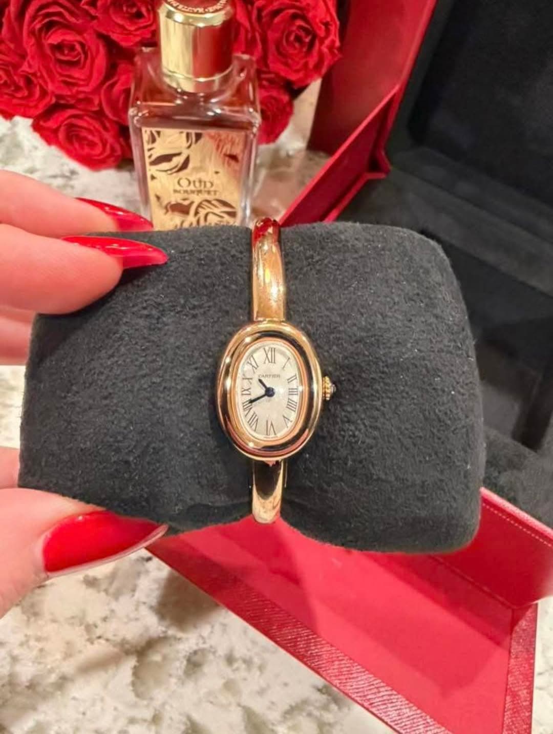 May be an image of wrist watch, fragrance and text