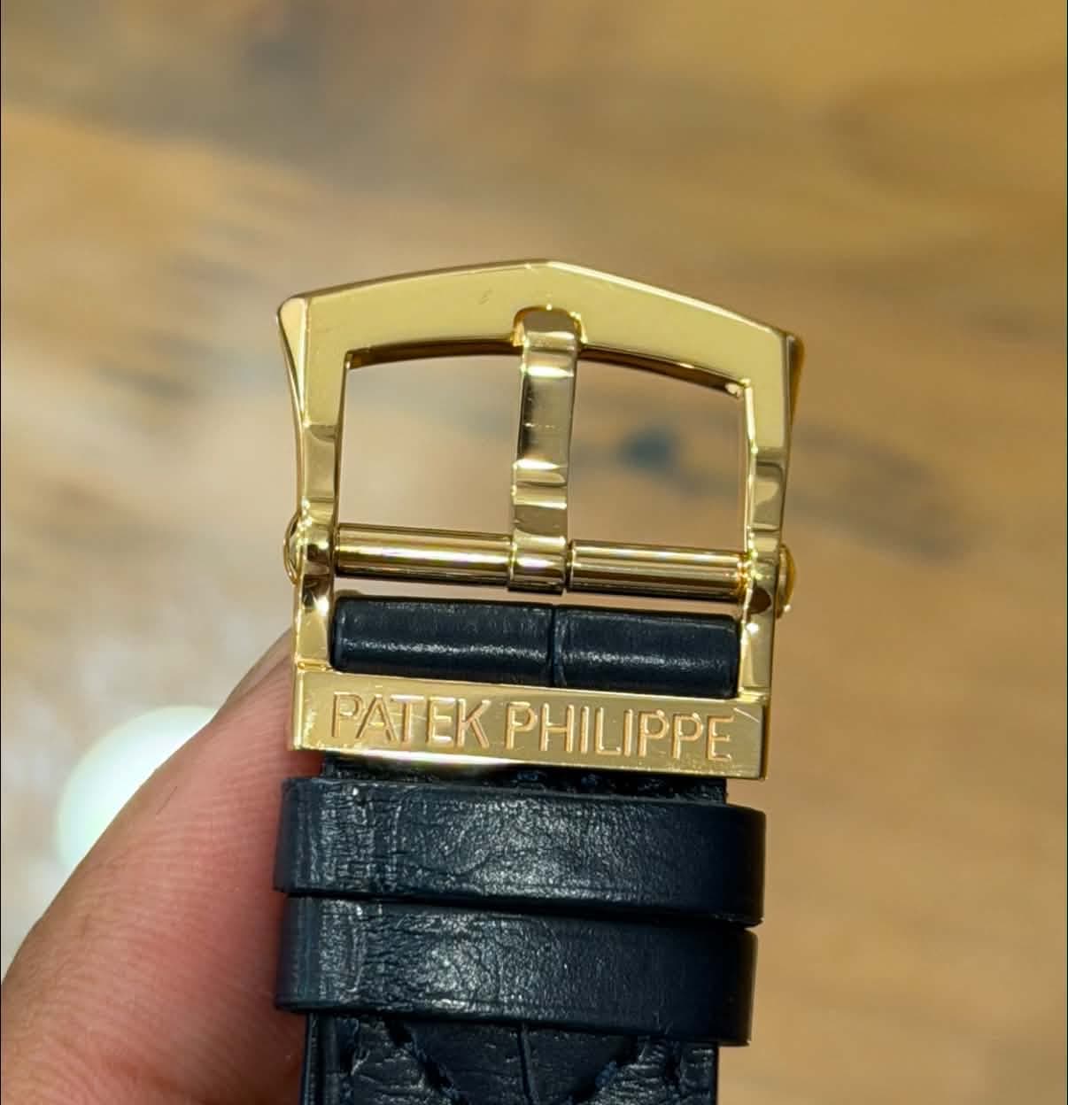 May be an image of wrist watch and text that says '99106/ PATEK PATEKPHILIPPE PHILIPPE'