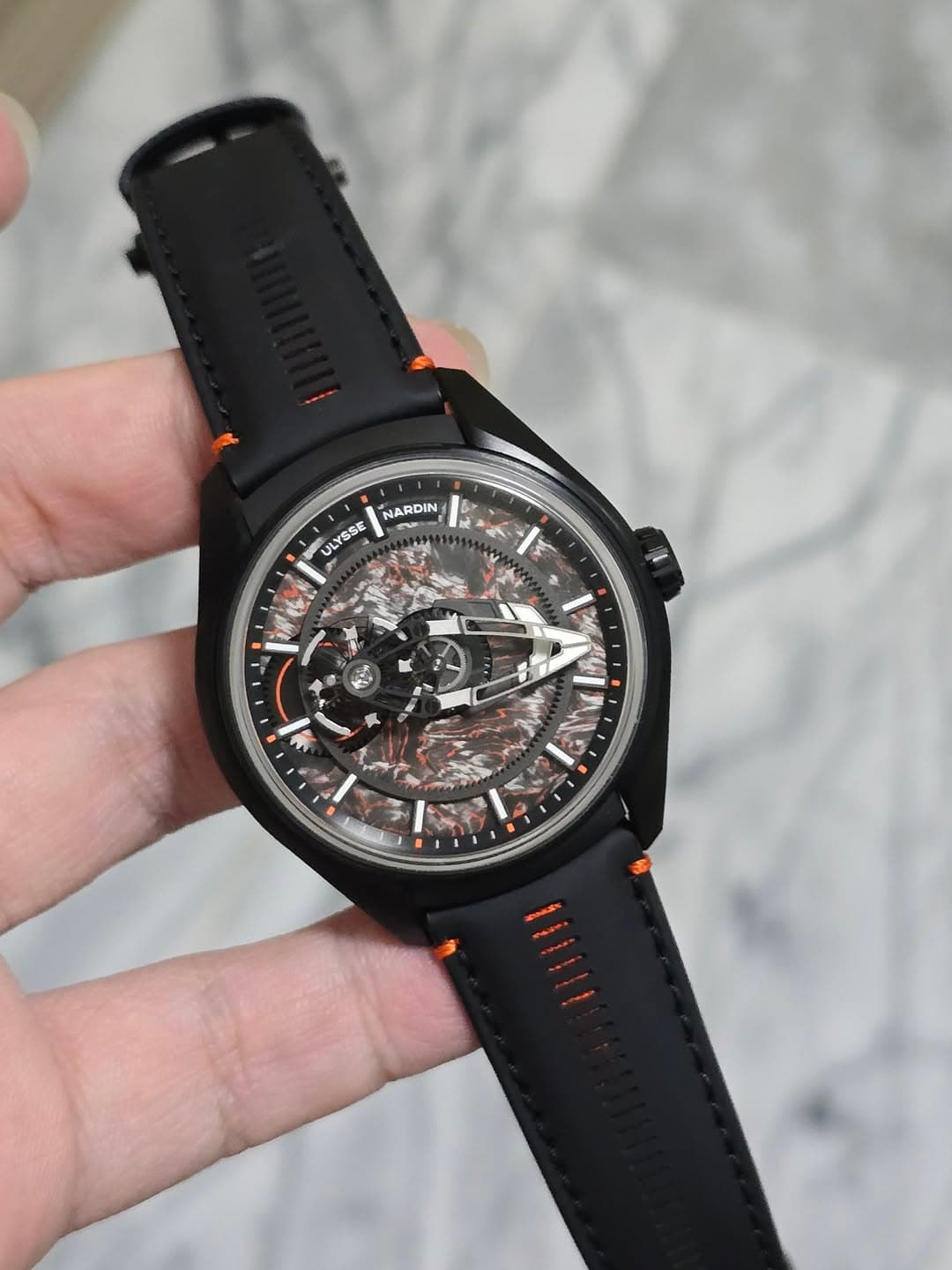 May be an image of wrist watch and text that says 'NARDIN 진 NARDIN ULYSSE I ወሆቅር ETM'