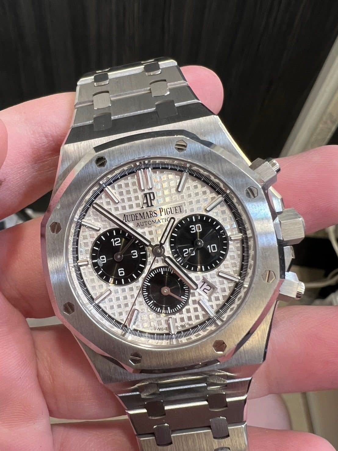 May be an image of wrist watch and text