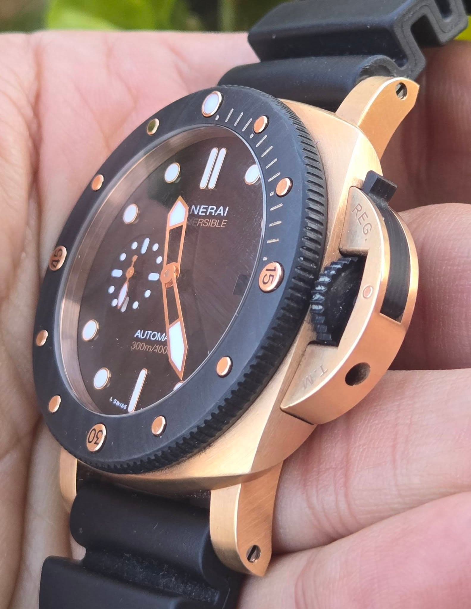 May be an image of digital watch and text that says ' NERAI RSIBLE R REG M O AUTOMA 300m/100 SWISS'