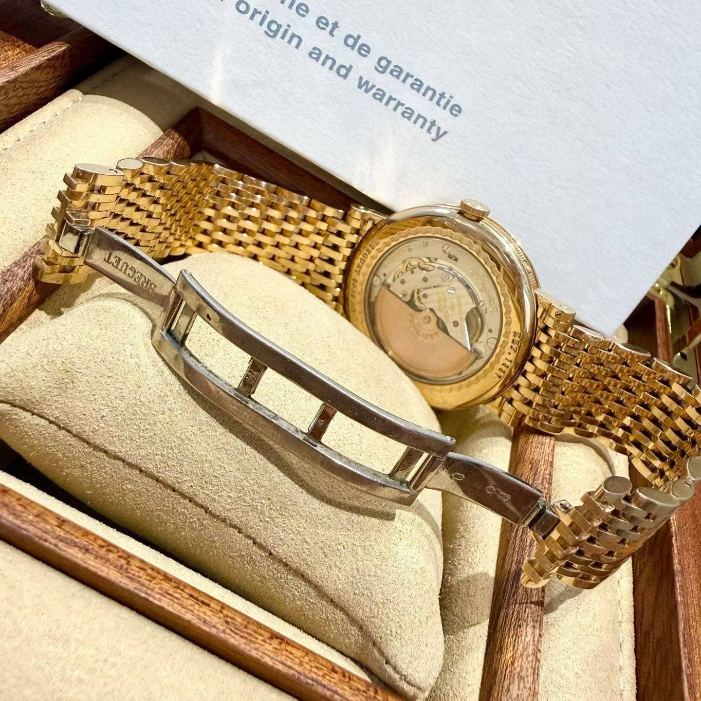 May be an image of wrist watch, jewelry and text