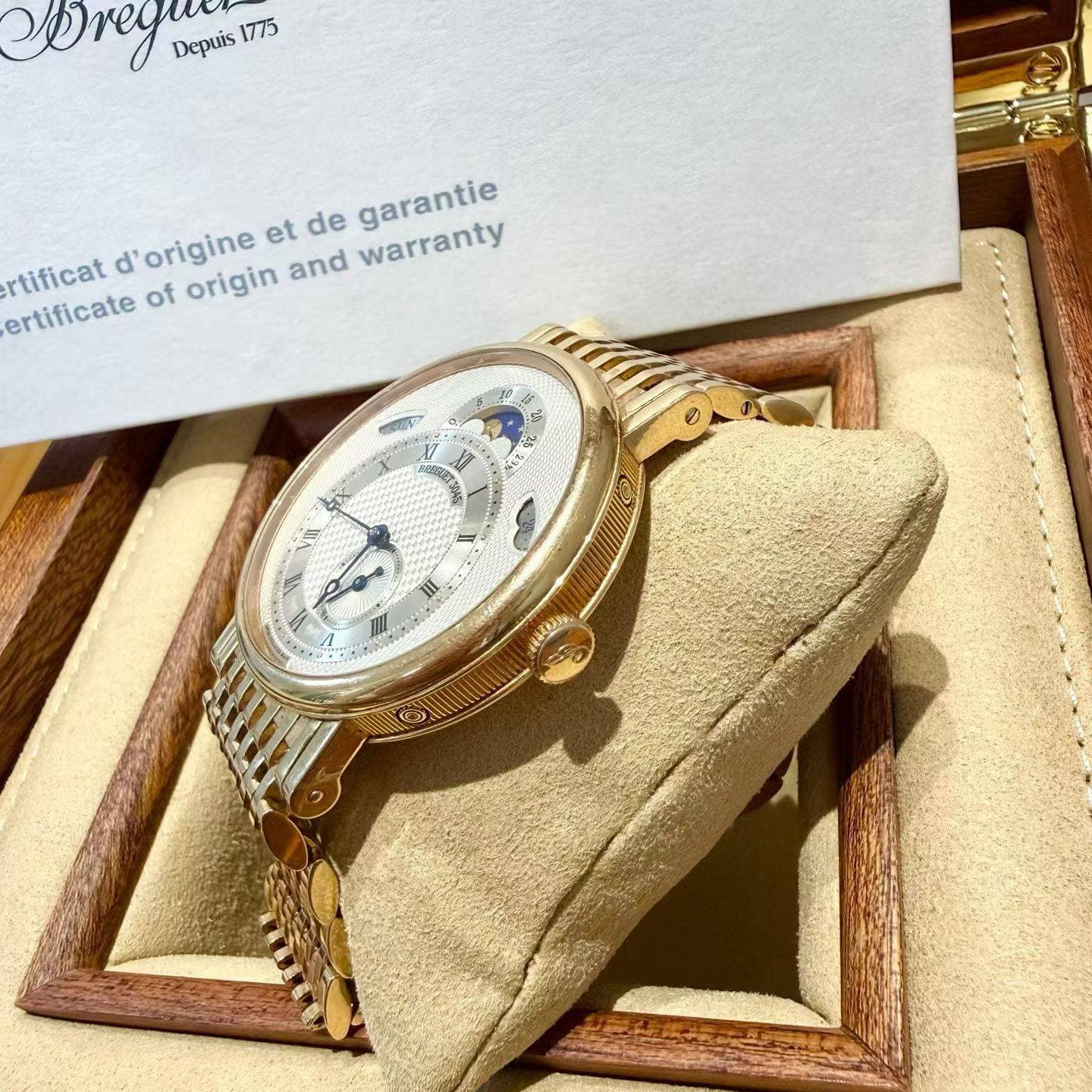 May be an image of wrist watch and text