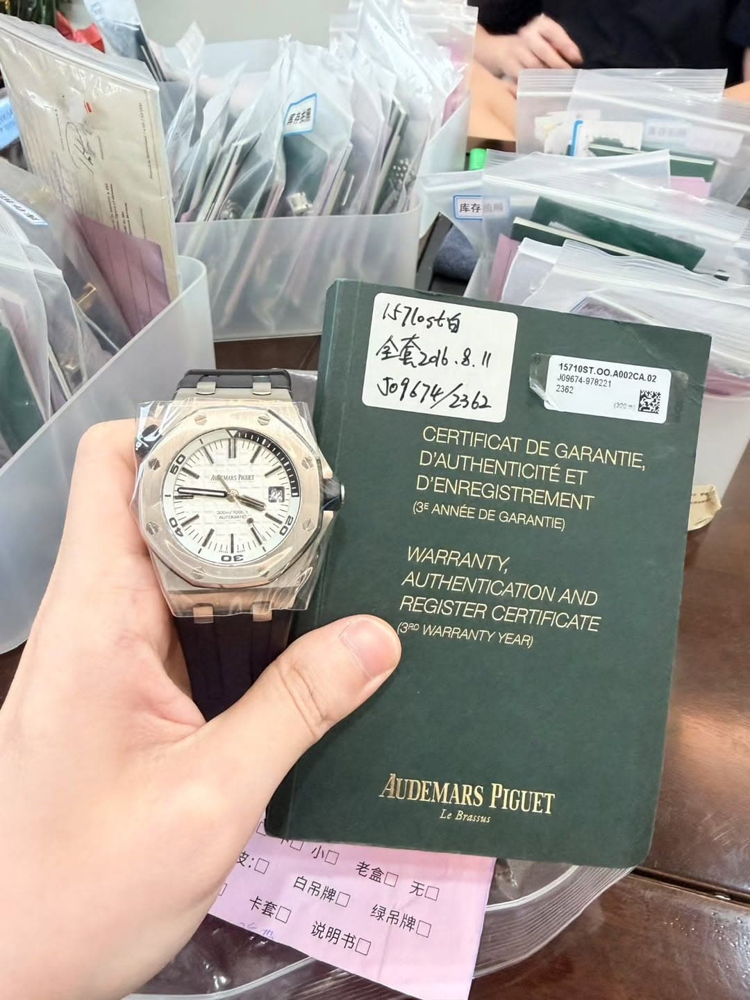 May be an image of wrist watch and text that says '养菇 ow 压存放 0m 15710ST. 0O. A.0 2362 は (ピー 2 50 U6s2n ف : ! OE 157(ost日 全重 J09674/2362 CERTIFICAT DE GARANTIE, ET…