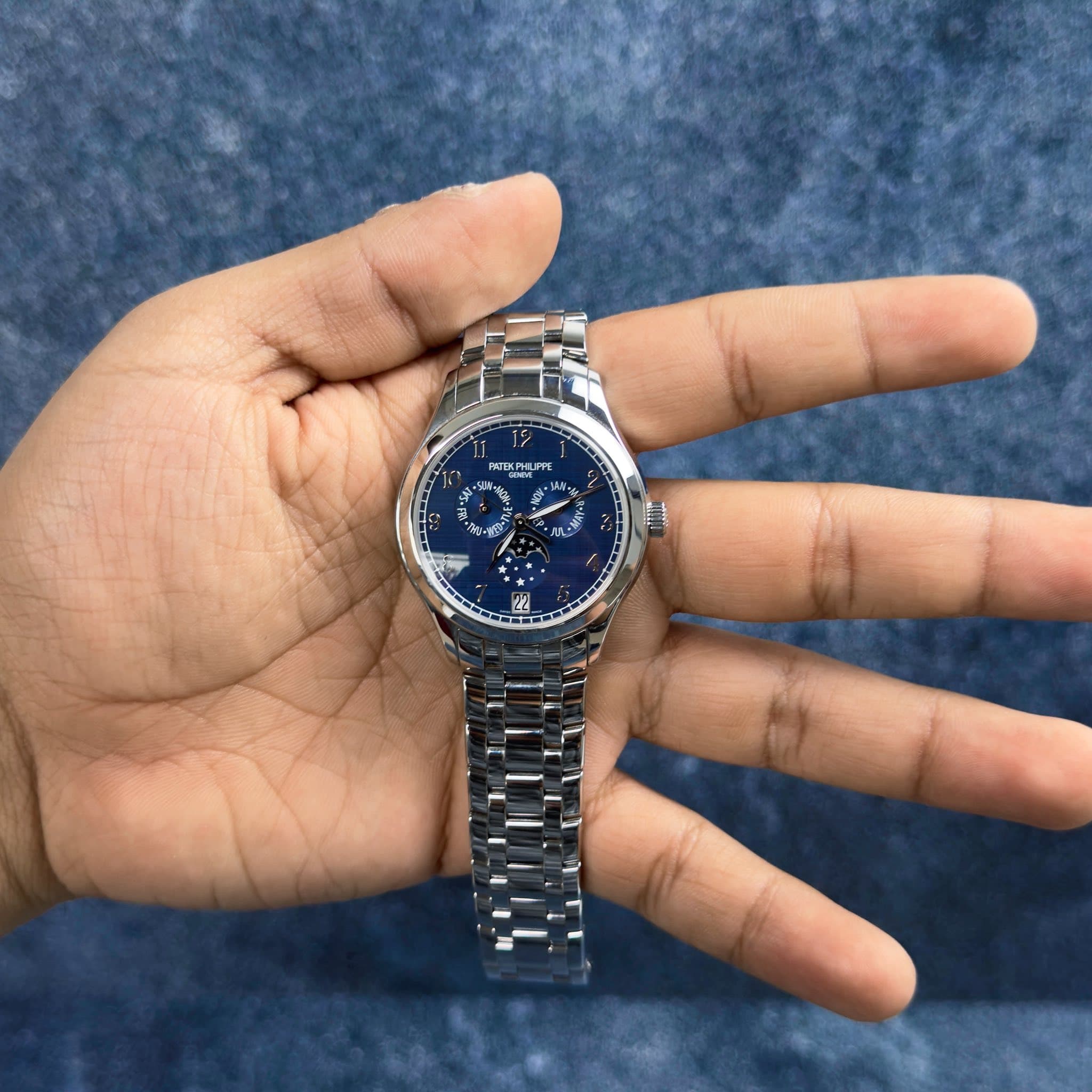May be an image of wrist watch and text