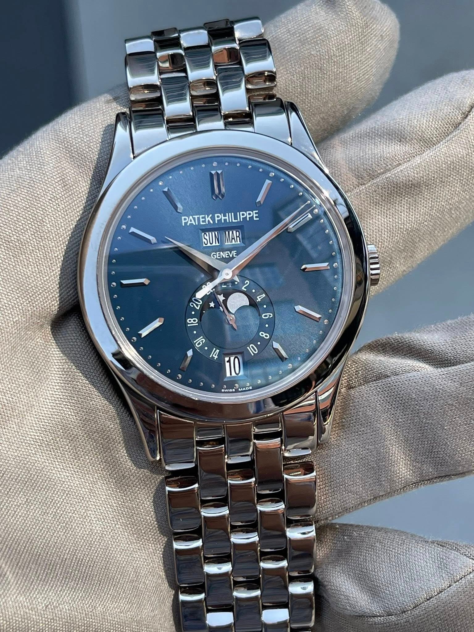May be an image of wrist watch and text that says '® PATEK PHILIPPE PATEKPHILIPPE PHILI SUN MAR GENEVE 20 0 ၅ I 8 F F 10 10 SUAR'