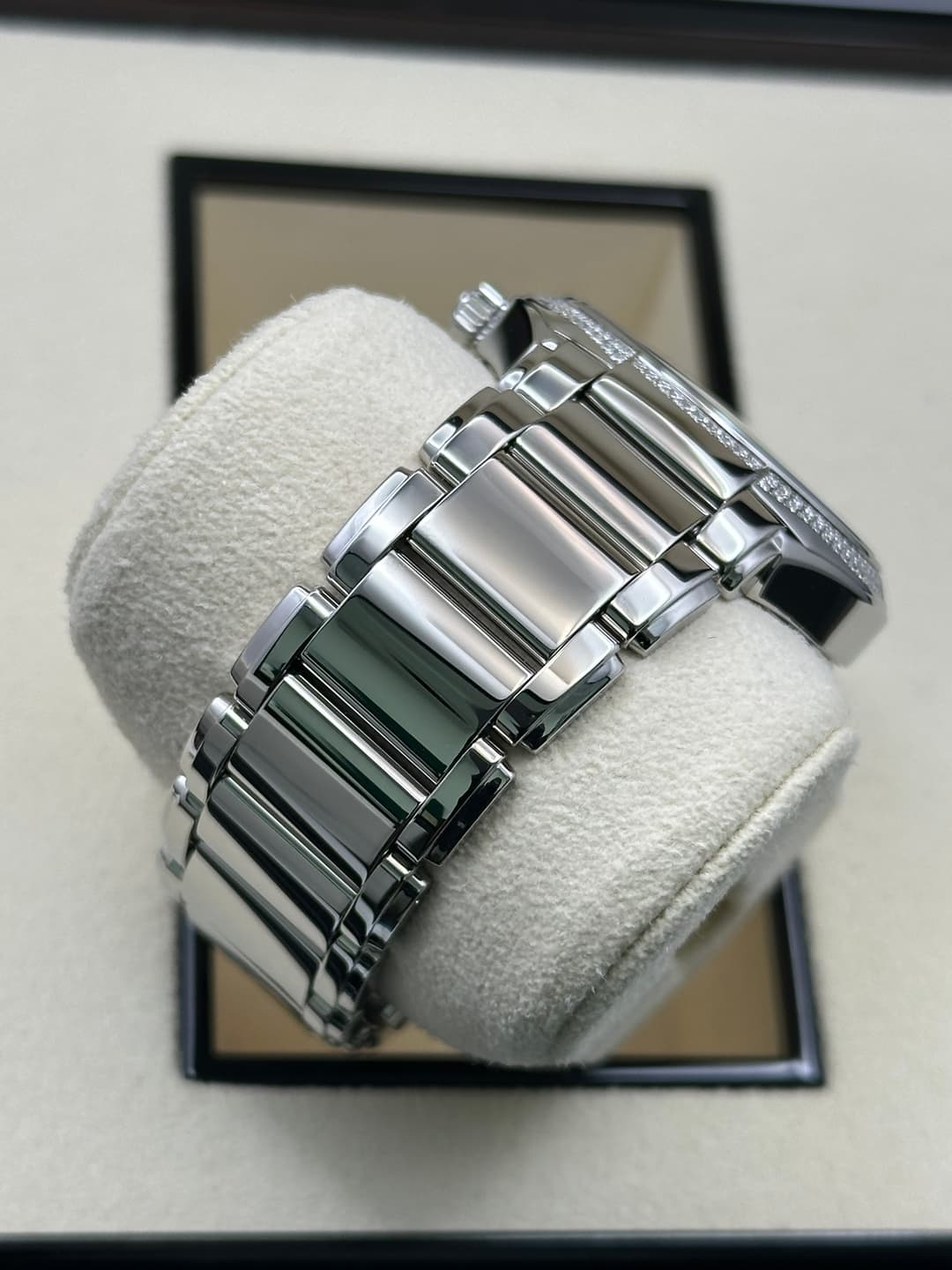 May be an image of jewelry, wrist watch and text