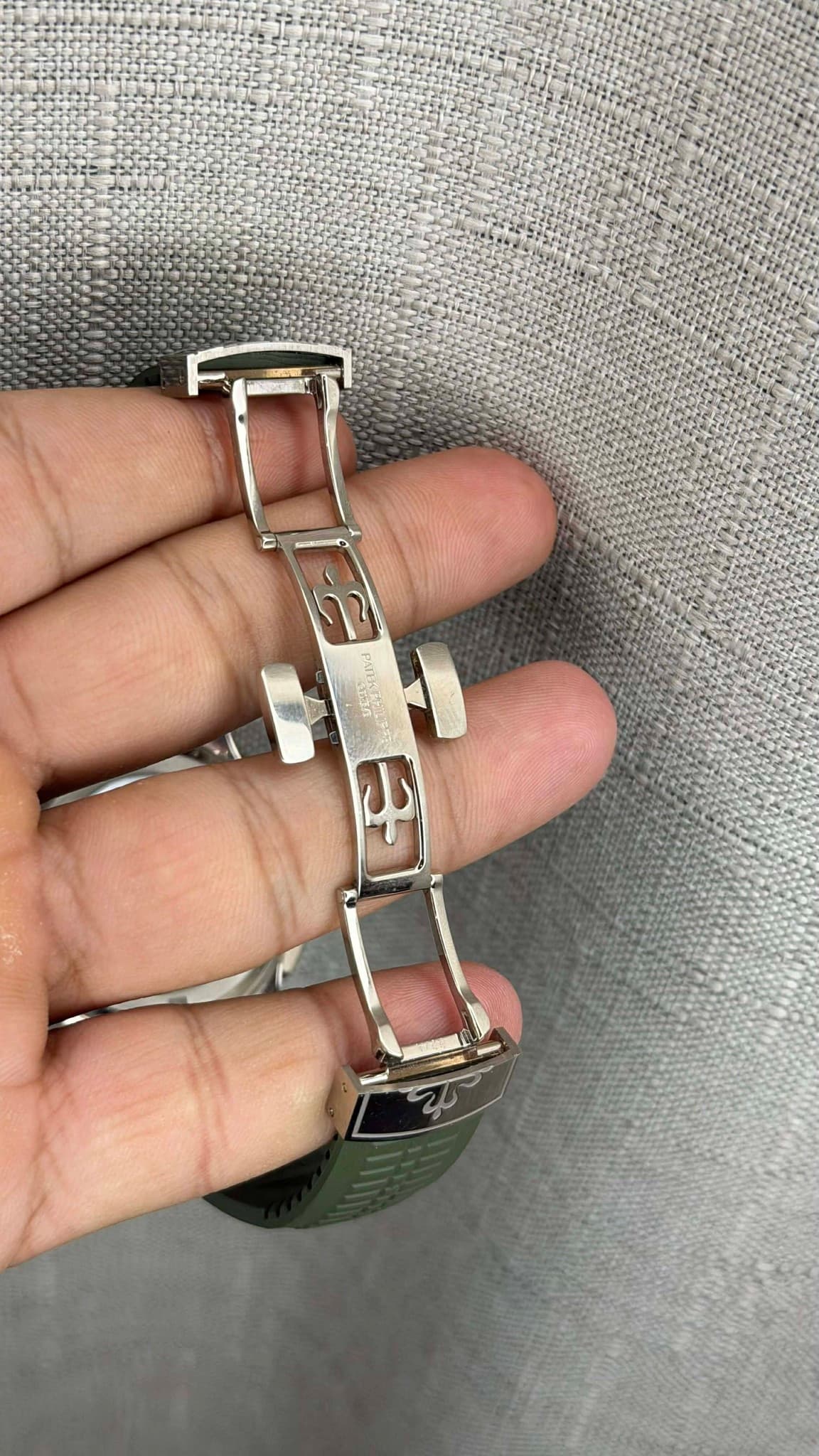 May be an image of wrist watch, jewelry and text