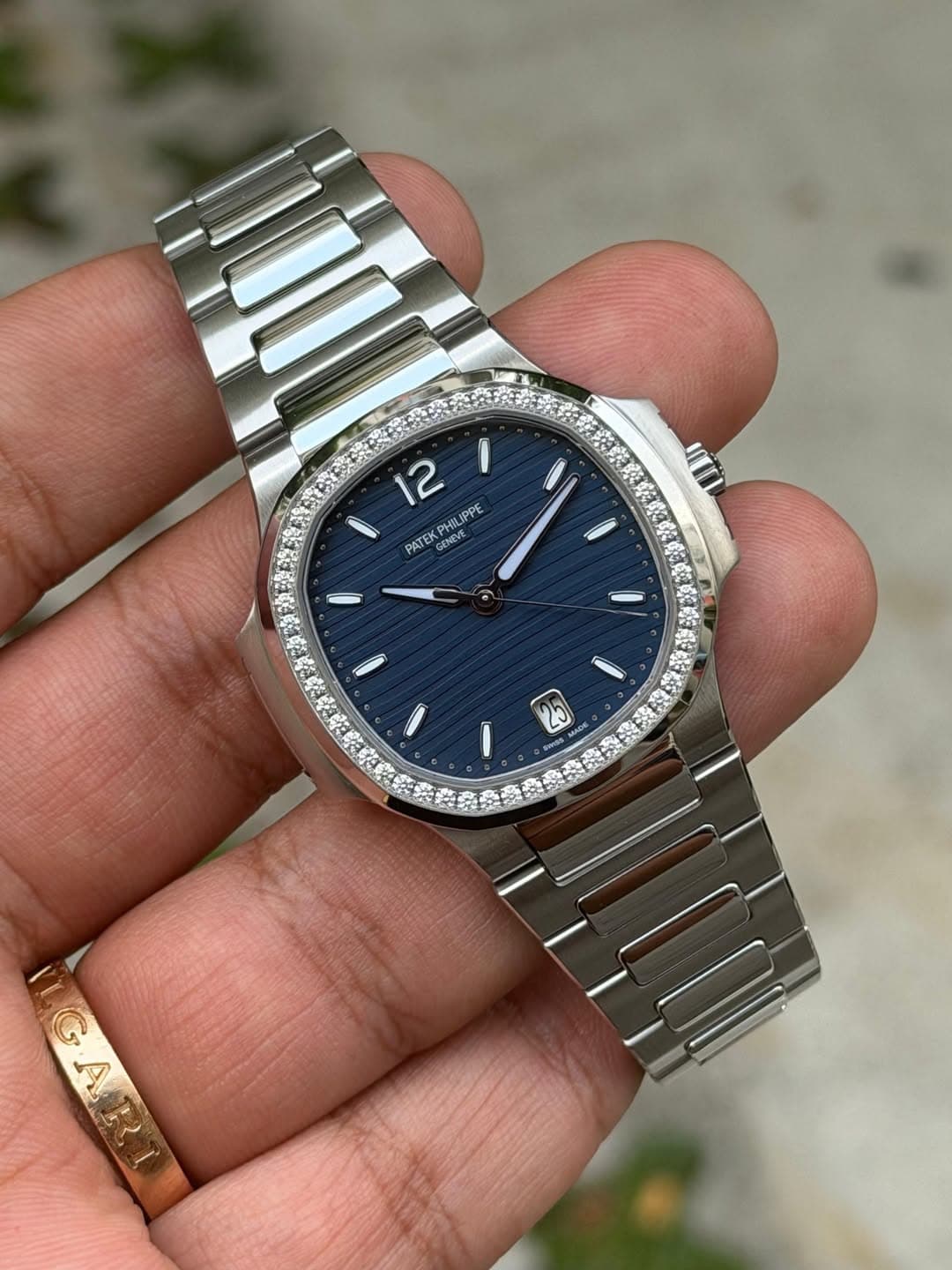 May be an image of wrist watch and text that says '12 IPPE PATE GENEVE GENLY I 25'
