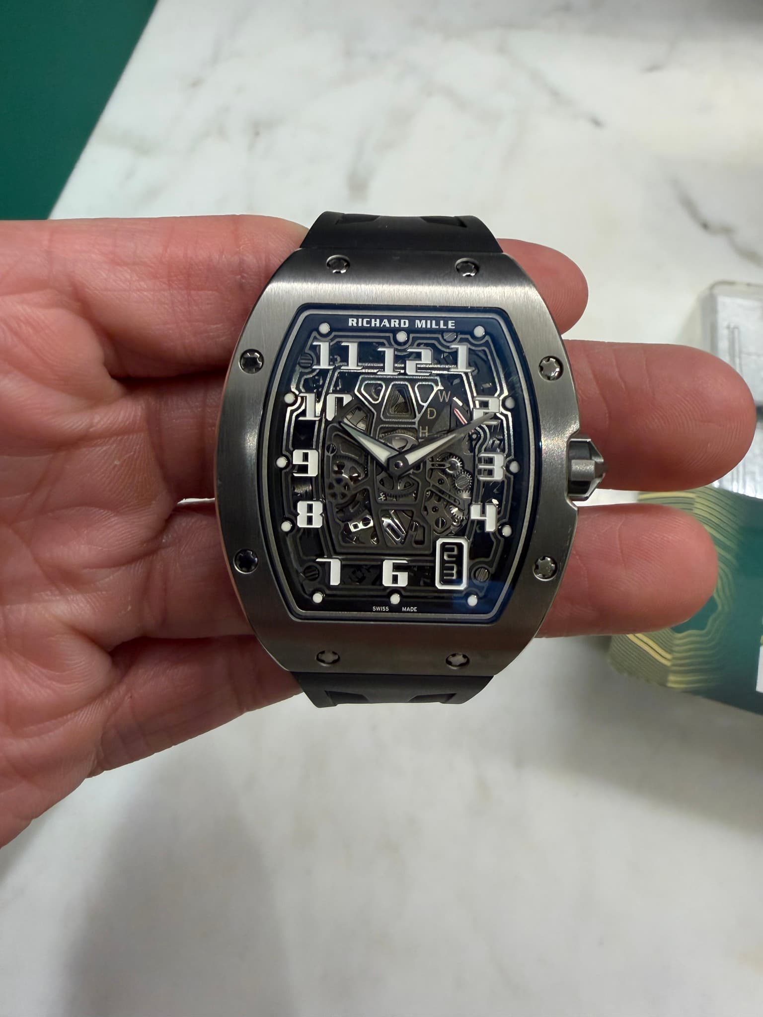 May be an image of wrist watch and text