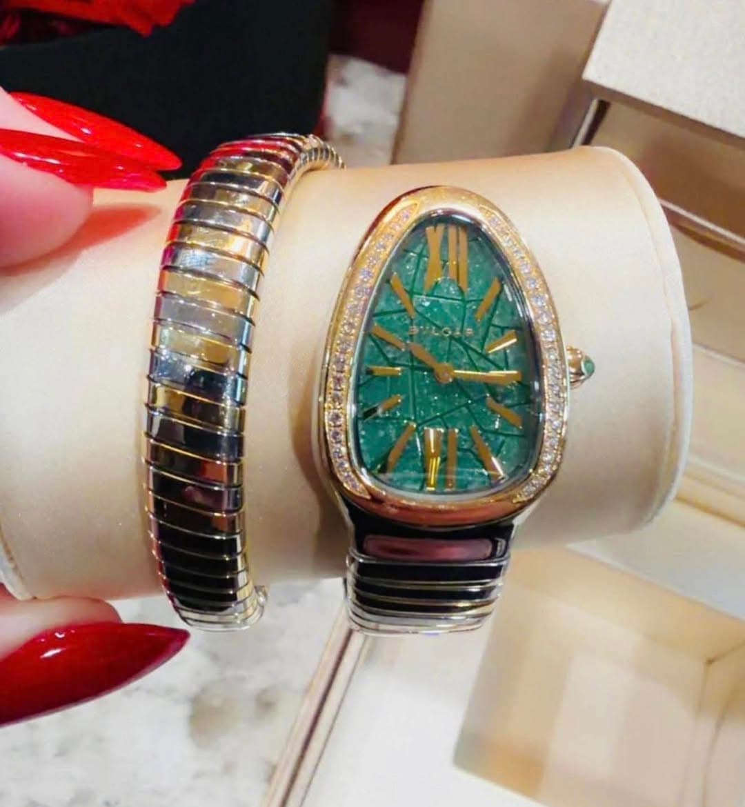 May be an image of jewelry and wrist watch