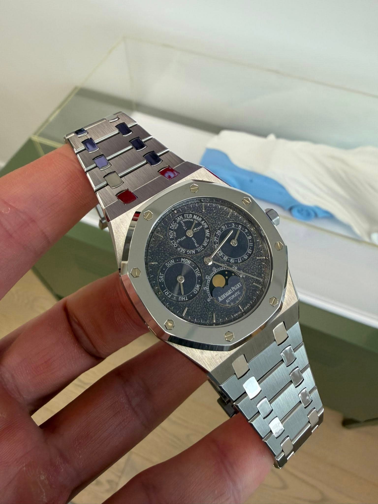 May be an image of wrist watch and text