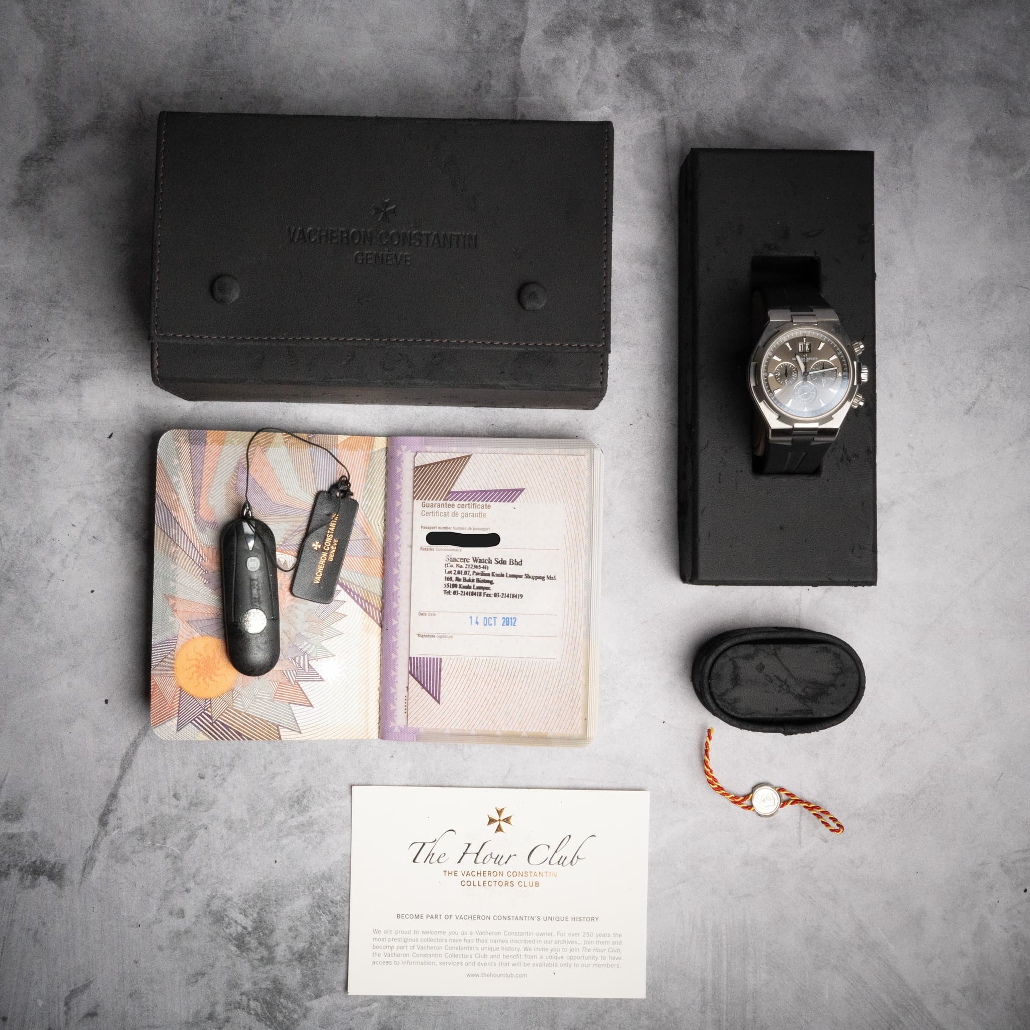 May be an image of leather wallet, knife, saddle-stitched leather, wrist watch and text