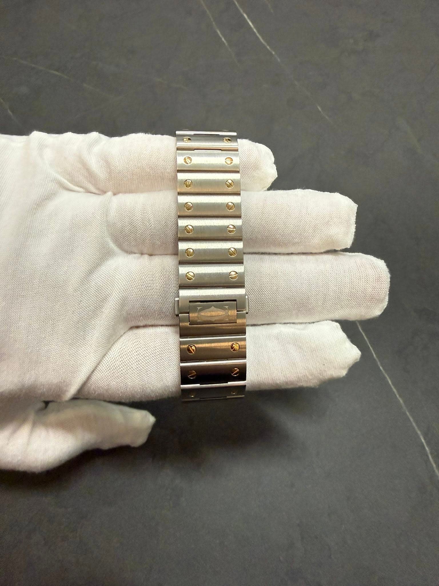 May be an image of wrist watch and jewelry