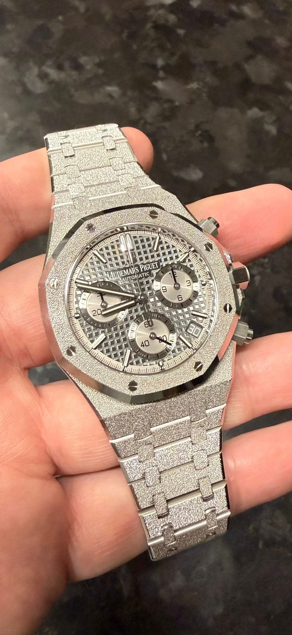 May be an image of wrist watch and text