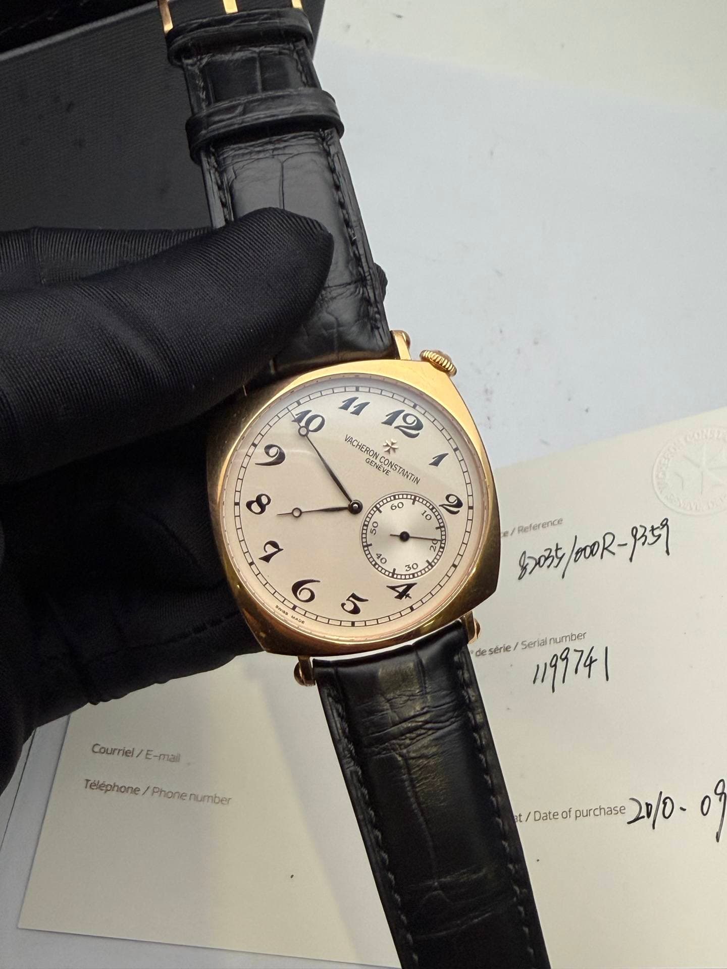 May be an image of leather, wrist watch and text