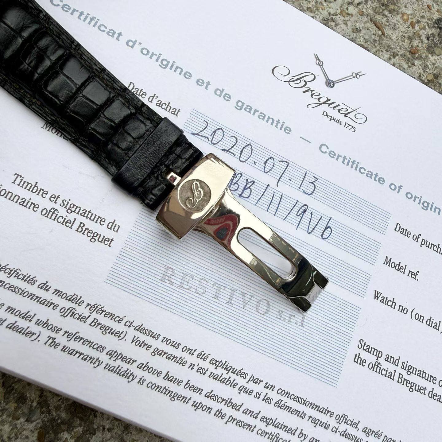 May be an image of leather, wrist watch, saddle-stitched leather and text that says 'MOT onnaire Timbre et officiel signature Breguet du ertificat origine origine et de Date d'…